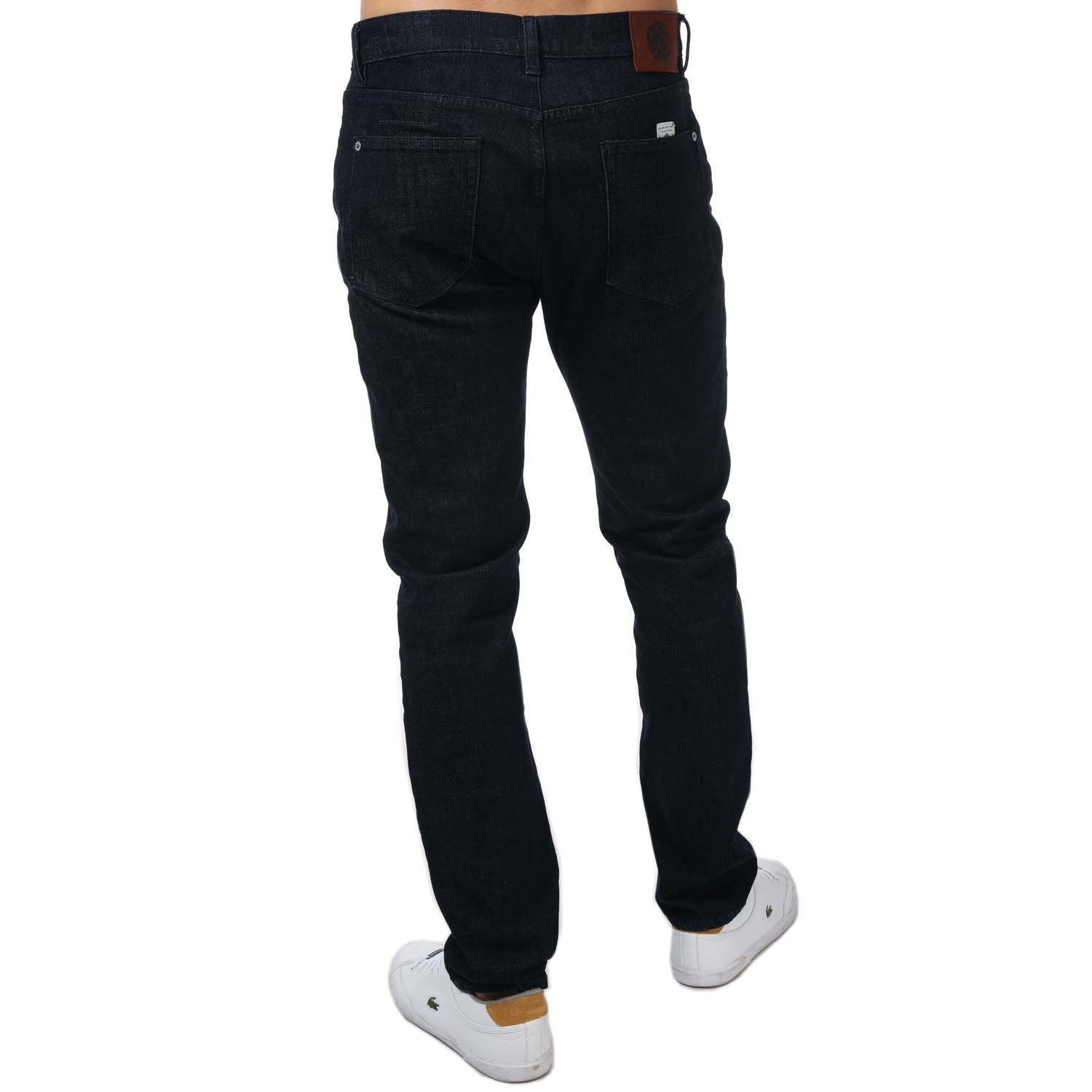 Mens Pretty Green Erwood Slim Fit Jeans in navy.- 5-pocket construction. - Concealed button fly closure.- Twin needle stitching.- Woven logo label at front waist band.- Branded arcuate at front coin pocket.- Embossed rivets and metal trims.- Hem chain stitch detail.- Complete with a branded leather patch.- Slim fit.- 99% Cotton  1% Polyurethane.- Ref: G21Q3MULEG598N