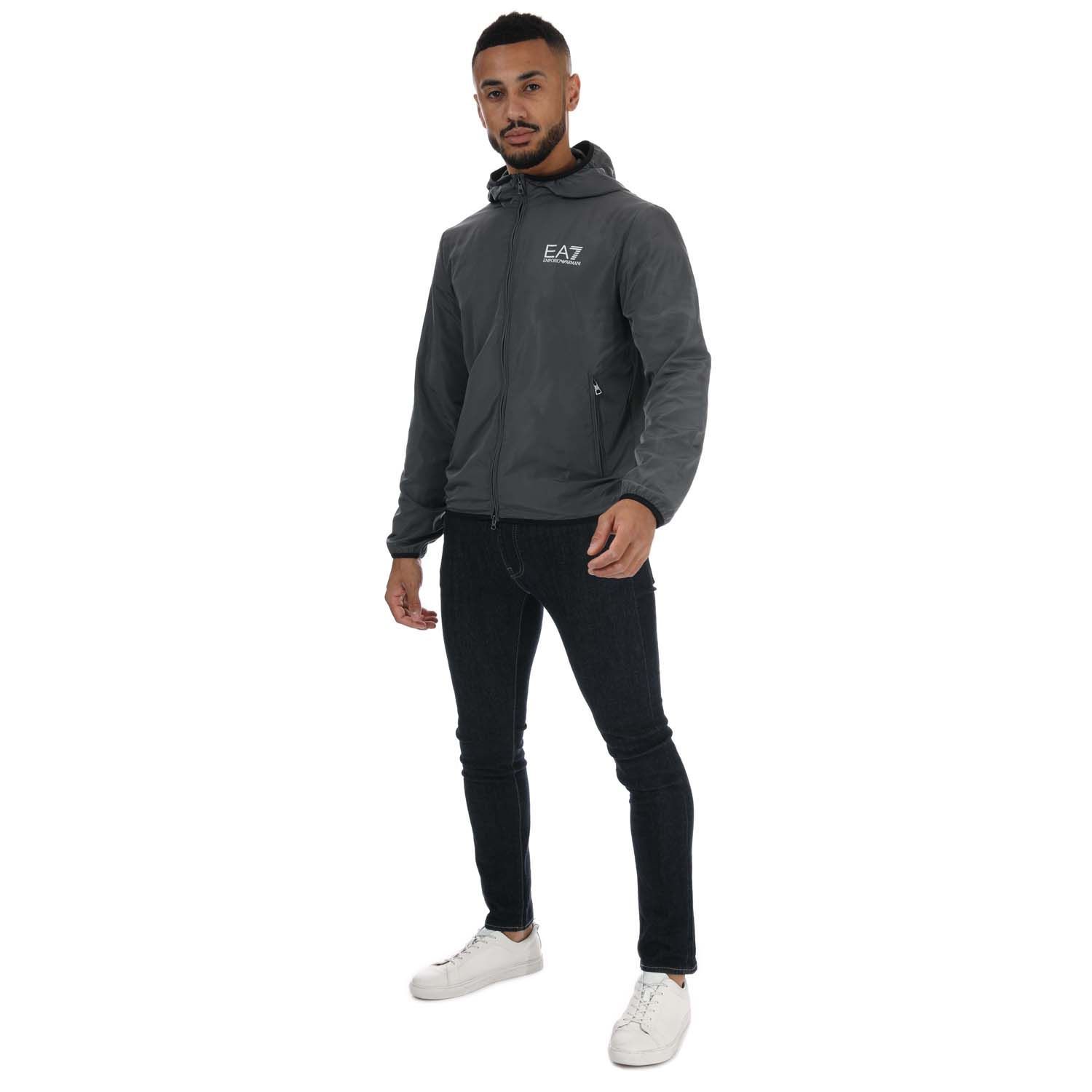 Mens Emporio Armani EA7 Fundamental Sporty Blouson Jacket in grey.- Attached drawstring hood.- Long sleeves.- Full zip fastening.- Two zipped front pockets.- Elasticated cuffs.- Contrasting EA7 logo on the chest.- 100% Polyester.- Ref: 8NPB04NN7Z1977