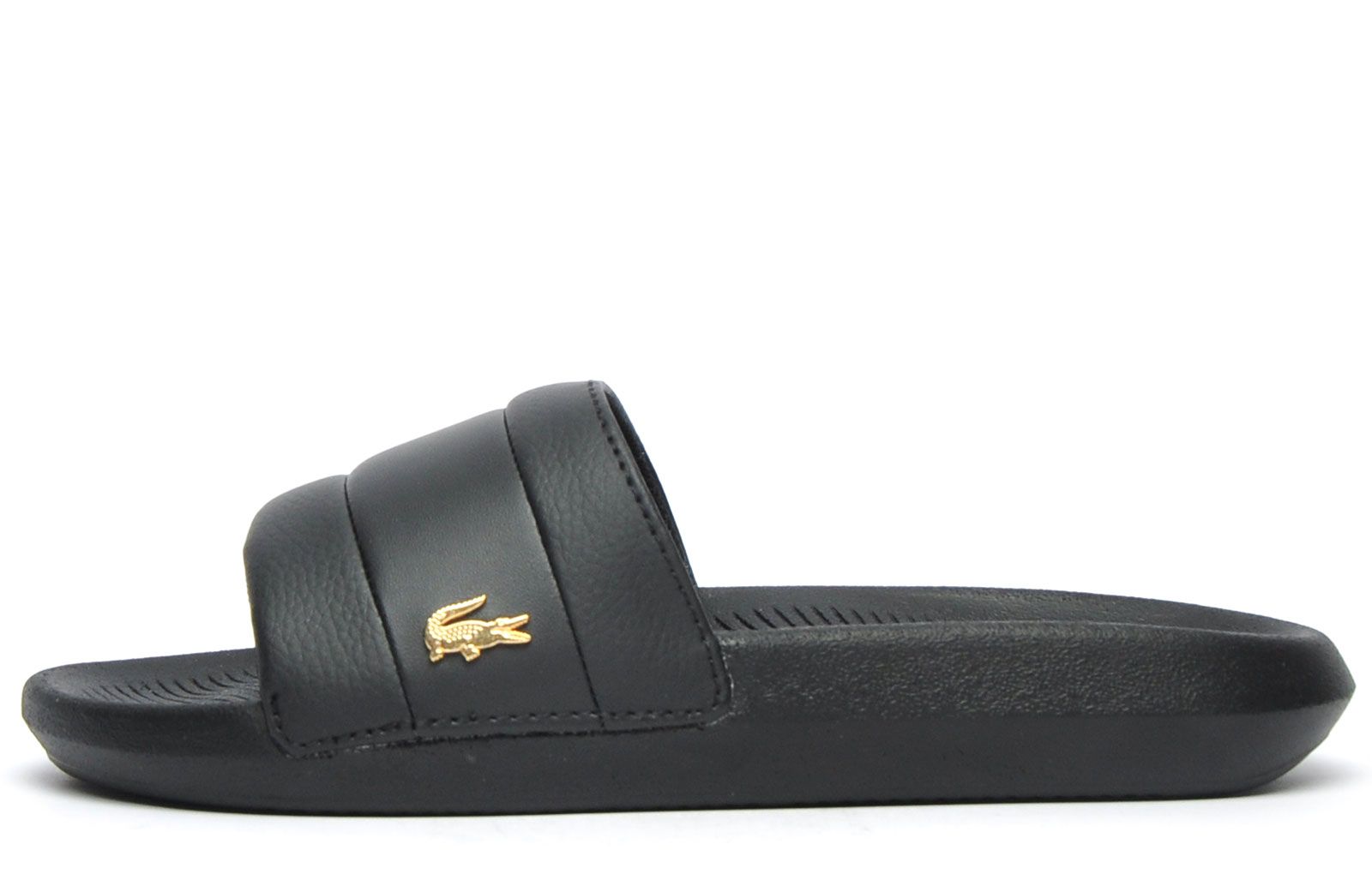 Step into on trend summer style with these women's / girlsCroco Slides from Lacoste. In a classic black colourway, these designer sandals are delivered in a smooth synthetic upper with band stripe detailing across the forefoot foot strap. The super comfy moulded footbed delivers the perfect fit and feel while the grippy outsole will keep you sure and safe around the pool or in the shower. These designer slides are finished with eye catching Lacoste branding throughout just in case you want a sign of approval that youre wearing cool chic style this summer season 
 - Synthetic comfort upper
 - Comfort moulded footbed
 - Single strap construction
 - Grippy outsole
 - Slip on wear
 - Iconic Lacoste branding throughout
 Please Note:
 These Lacoste Slides are sold as B grades which means there may be some very slight cosmetic issues on the shoe and they come in a poly bag. There could be occasional issues with wrong swing tags being allocated to wrong shoes by Lacoste themselves which could result in some size confusion but you must take the size IN THE SHOE as the size that the shoe actually is ( not what is on the tag ). We have checked most of the shoes and in our opinion,all are practically perfect without any blemishes on them at all and in essence if the shoes did not have the letter B denoted on the swing tag you would presume these were perfect shoes. All shoes are guaranteed against fair wear and tear and offer a substantial saving against the normal high street price. The overall function or performance of the shoe will not be affected by any minor cosmetic issues. B Grades are original authentic products released by the brand manufacturer with their approval at greatly reduced prices. If you are unhappy with your purchase, we will be more than happy to take the shoes back from you and issue a full refund