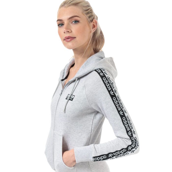 Womens adidas Originals R.Y.V. Zip Hoody in light grey heather.<BR><BR>- Drawcord-adjustable hood.<BR>- Full zip fastening.<BR>- Long raglan sleeves with double linear Trefoil logo tape.<BR>- Woven double linear Trefoil logo at left chest.<BR>- Kangaroo style pockets to front.<BR>- Ribbed cuffs and hem.<BR>- Contrast back neck tape.<BR>- Slim fit.<BR>- Measurement from shoulder to hem: 24“ approximately.  <BR>- Main material: 100% Cotton.  Hood lining: 100% Cotton.  Rib: 95% Cotton  5% Elastane.  Machine washable.<BR>- Ref: FI7109<BR><BR>Measurements are intended for guidance only.