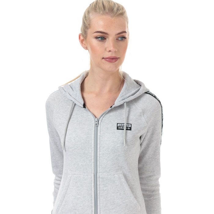 Womens adidas Originals R.Y.V. Zip Hoody in light grey heather.<BR><BR>- Drawcord-adjustable hood.<BR>- Full zip fastening.<BR>- Long raglan sleeves with double linear Trefoil logo tape.<BR>- Woven double linear Trefoil logo at left chest.<BR>- Kangaroo style pockets to front.<BR>- Ribbed cuffs and hem.<BR>- Contrast back neck tape.<BR>- Slim fit.<BR>- Measurement from shoulder to hem: 24“ approximately.  <BR>- Main material: 100% Cotton.  Hood lining: 100% Cotton.  Rib: 95% Cotton  5% Elastane.  Machine washable.<BR>- Ref: FI7109<BR><BR>Measurements are intended for guidance only.