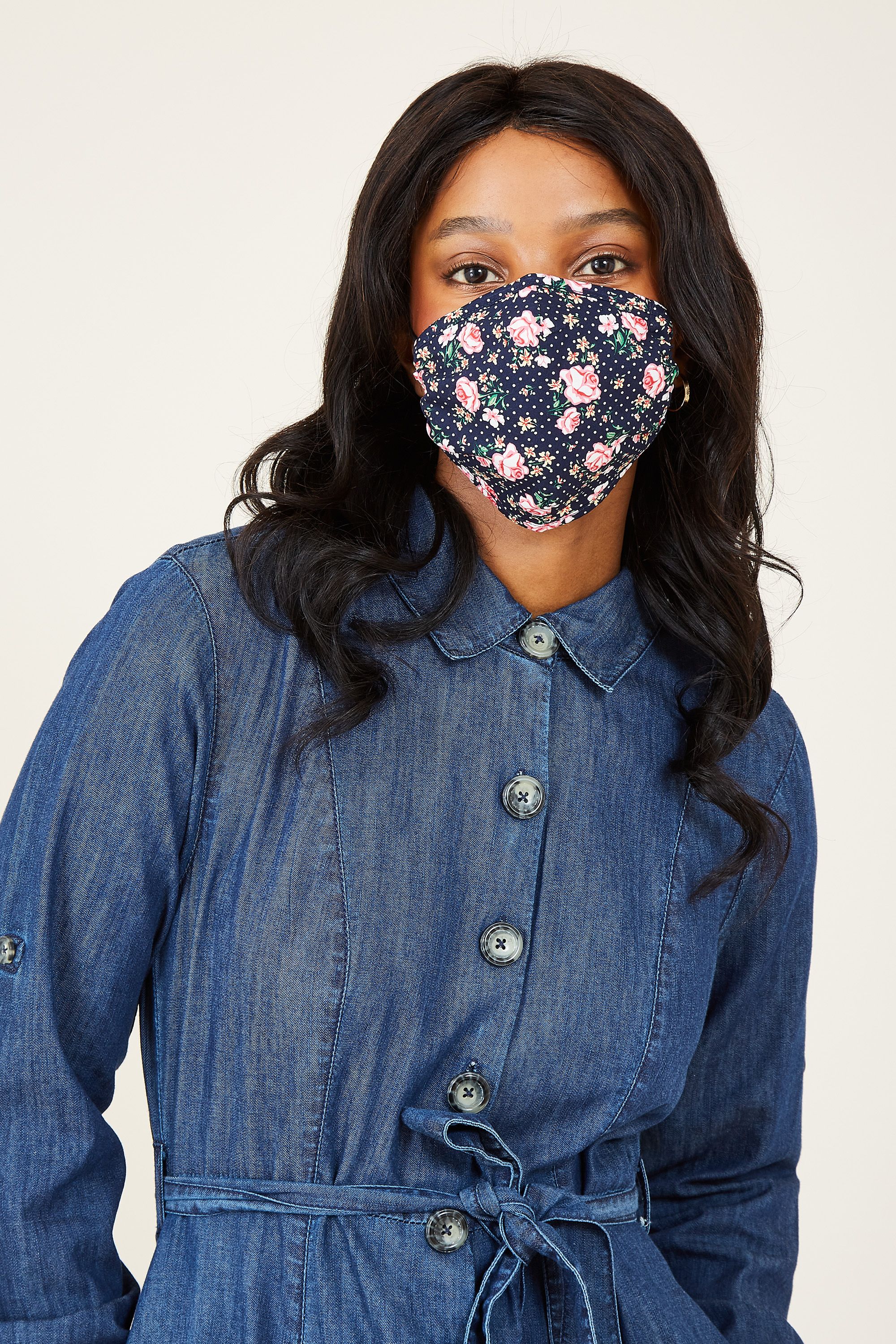 Designed with a pretty double print, this comfortable Rose Spot Face Covering is cut from soft cotton. It's made from the end of our fabric rolls, so it's sustainable and kind to the planet.Please remember it is a non-medical mask and not PPE. Wash your hands before and after putting on the covering. One Poundfrom each covering is donated to Sufra, a charity that supports and provides food for people in extreme poverty.  100% Cotton, Lining:100% Cotton