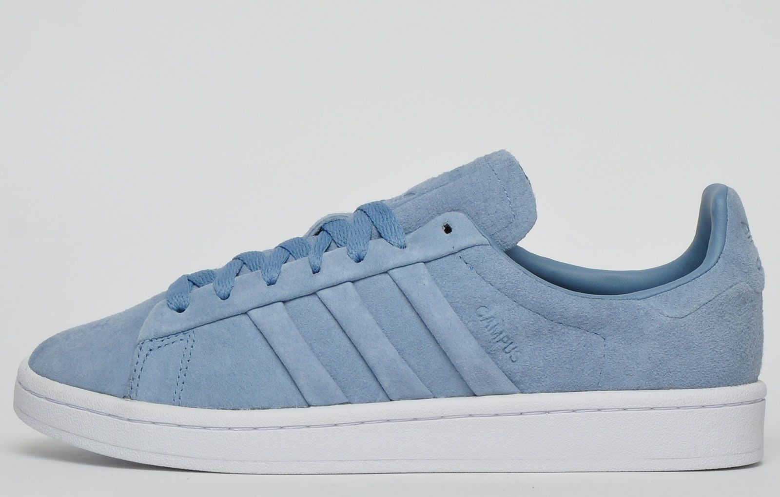 <p>A court icon that has stood the test of time, the Adidas Originals Campus returns with a premium makeover look. This classic trainer showcases a soft smooth nubuck suede leather upper, giving it a premium feel. The 3-Stripes and heel patch are presented in complimentary fashion while a durable vintage styled outsole ensures that you can enjoy these trainers all year round</p> <p>- Premium nubuck suede leather upper</p> <p>- Soft sumptuous lining</p> <p>- Padded insole provides comfort and freshness</p> <p>- Durable rubber outsole</p> <p>- Adidas Originals branding throughout</p>