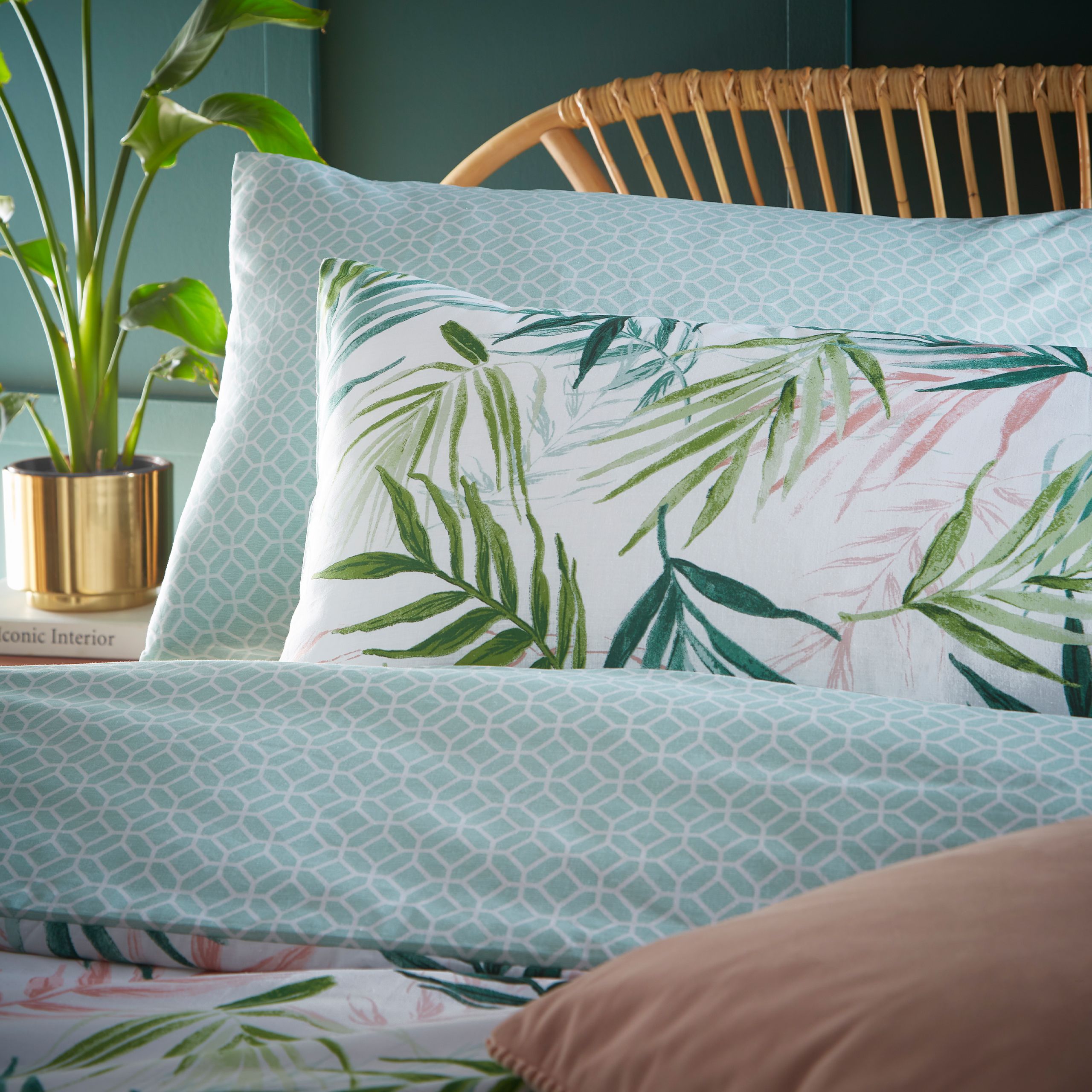Add an exotic, summery vibe to your bedroom with the Bali Palm reversible duvet cover set featuring swathes of palm leaves in jungle greens and pinks. With a calming geometric print reverse, for a fresh and versatile alternative.