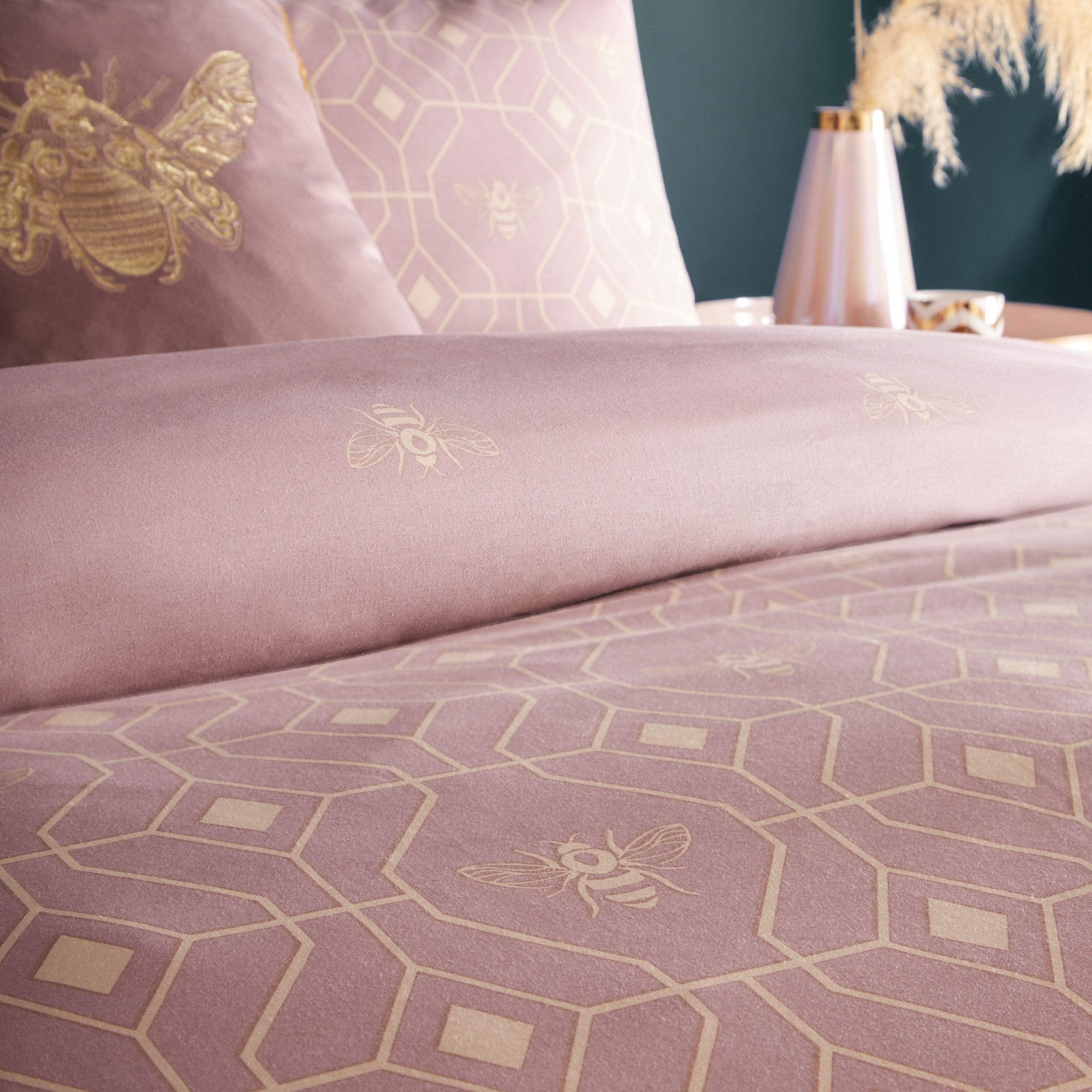The Bee Deco Duvet Cover and Pillow Case Set fuses the royal bee with a soft gold geometric design on a blush pink background. Bringing elegance and style to your bedroom, this bedding set is complete with a reversible design, clear button closure and easy care properties.
Measurements are as below for each size in this range;
Single: 137 x 200cm (includes one matching pillowcase)
Double: 200 200cm (includes two matching pillowcases)
King: 230 x 220cm (includes two matching pillowcases)
Super King: 260 x 220cm (includes two matching pillowcases)