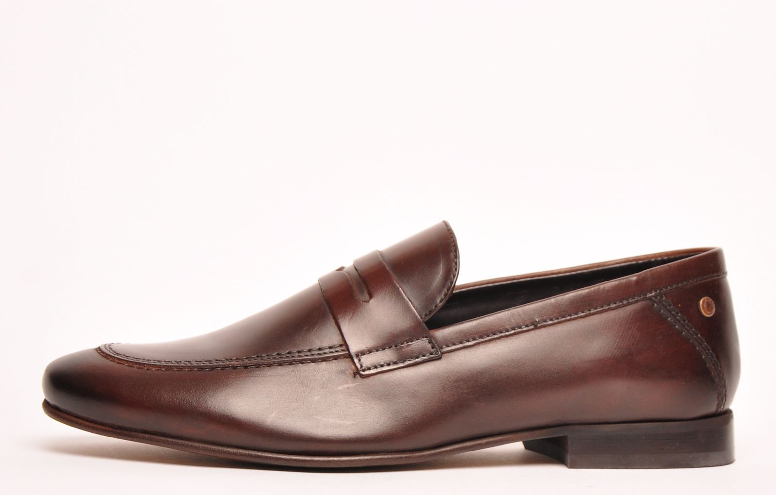 <p>Base London's Tenor exudes class and sophistication and is sure to add a little style to your outfit. Featuring a true loafer design in a premium brown leather upper, full of depth and character, this easy to wear slip-on loafer by Base London offers fantastic underfoot comfort and luxury with a high-quality durable outsole, giving this shoe a super comfy feel with every step you take. Featuring subtle refined neat stitch detail throughout as well as a cushioned patterned insole to give added comfort, these Base London Tenor Loafers embody a great sophisticated versatility that will look equally as refined with any casual or formal outfit - a classic wardrobe staple </p> <p> </p> <p style=