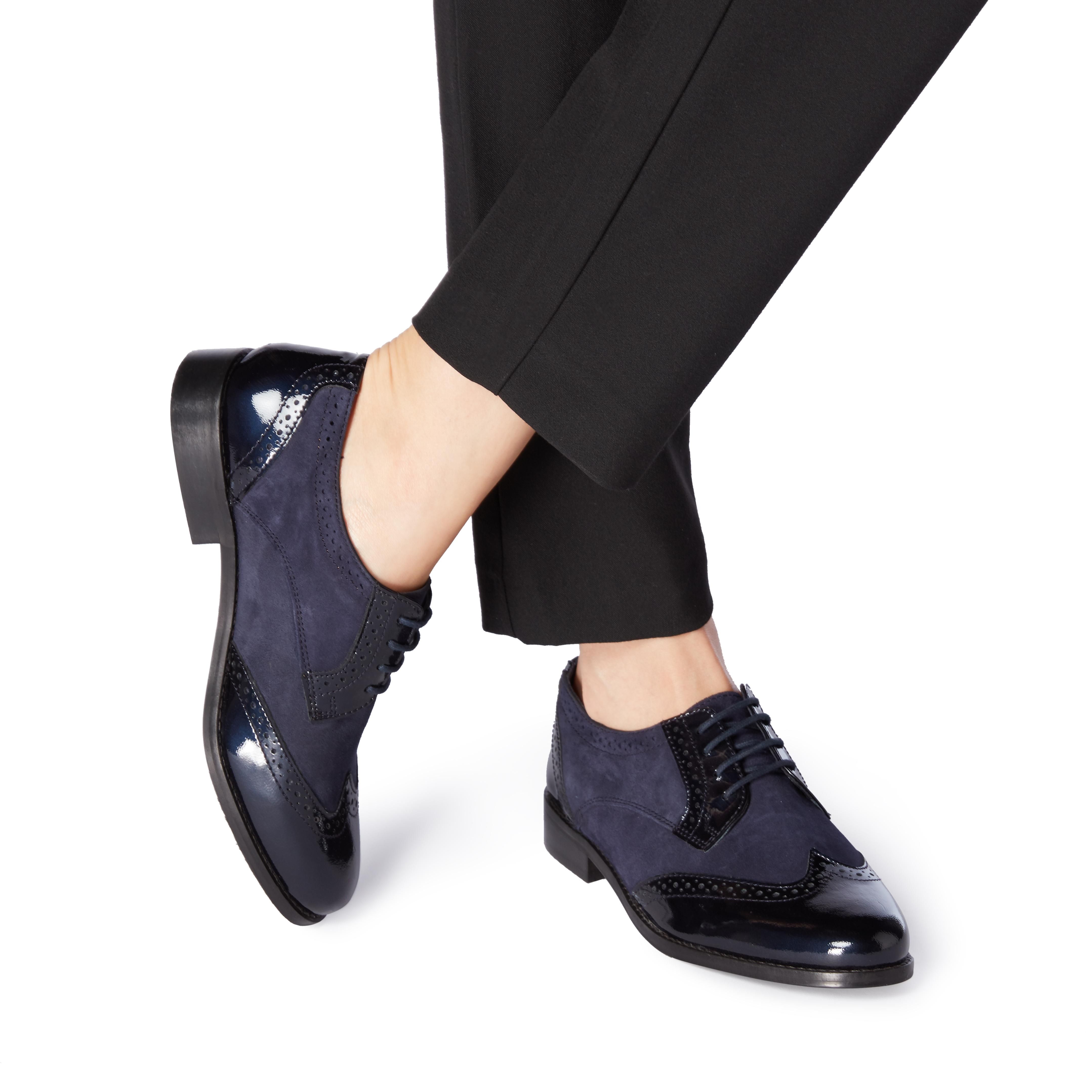 Foxxy is the perfect androgynous brogue shoe with a luxe finish. This lace up style features a round toe and classic wingtip design. The punch hole detailing and multi texture upper complete this look.