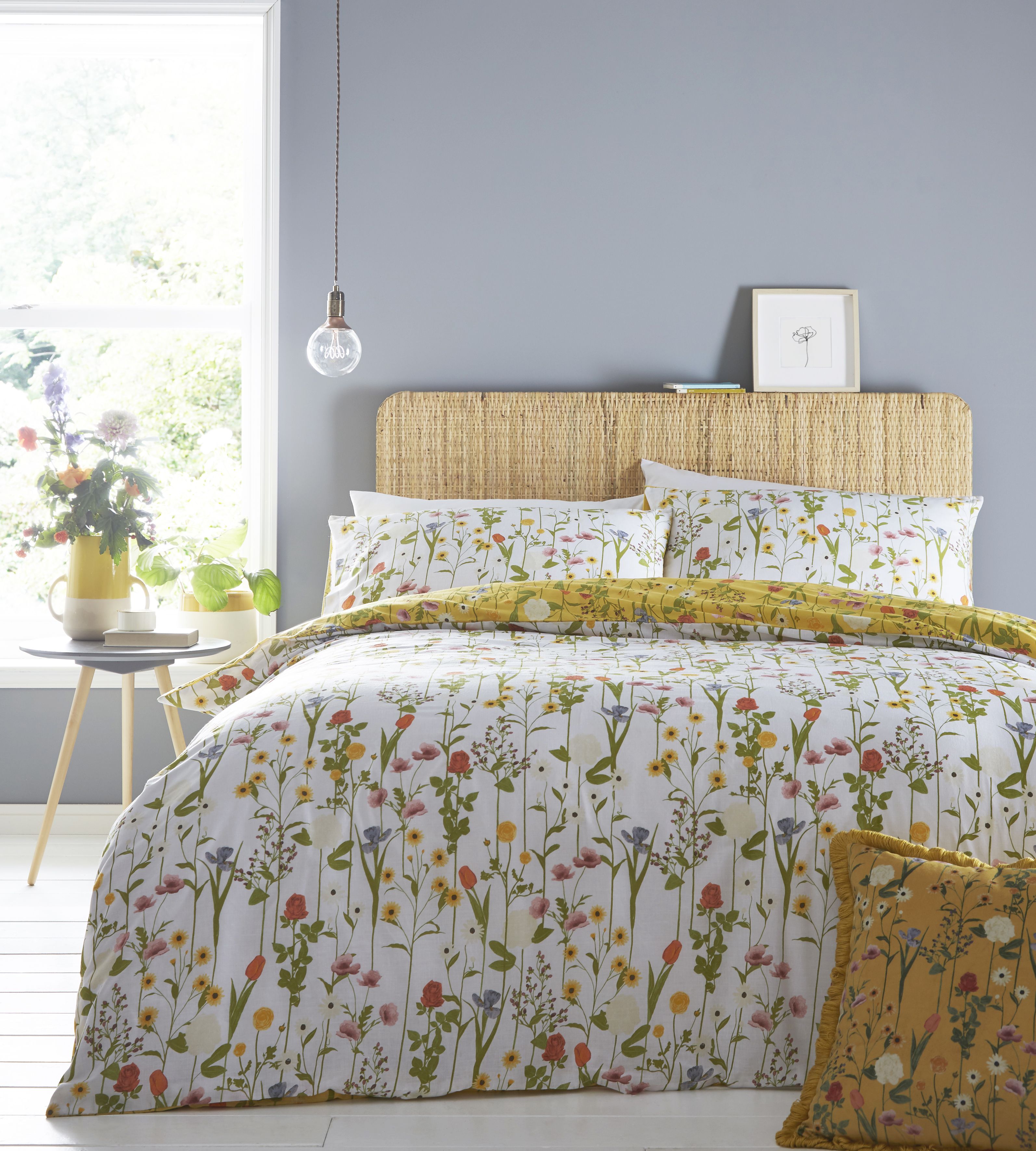 A beautiful and bold hand-painted botanical print, Fleura features delicate stems of soft petalled flowers creating a covering of colour. The flowers are also splashed over the reverse against a white base, for a more subtle and gentle look.