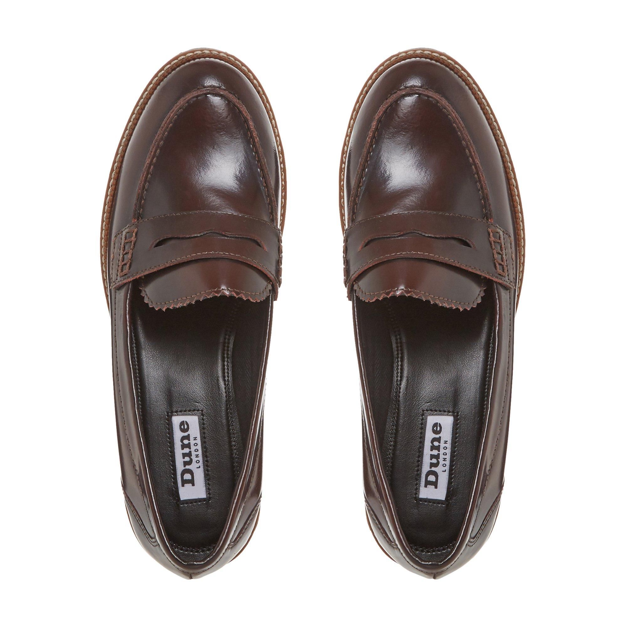 For sophisticated footwear, look no further than Dune's Gecho loafer. Made from semi-patent leather for a timeless finish. It rests on a chunky sole detailed with contrasting topstitch.