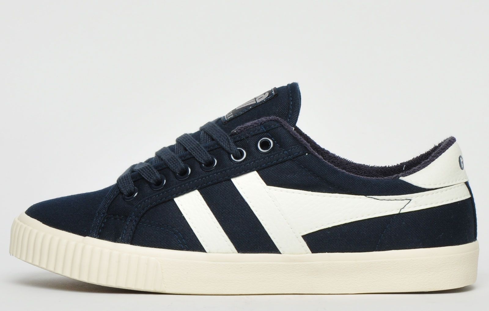 The Gola Classics Tennis Mark Cox is an update of the original Gola Tennis shoe design from 1973. Featuring a navy canvas textile upper with contrasting Gola branding and a sleek vintage styled sole to give a clean and fresh look. Offering enhanced comfort with a padded soft brushed lining and padded insole, its versatile style can be teamed with a variety of looks to add a relaxed touch to any outfit. <p>- Retro style trainers</p> <p>- Vegan Friendly</p> <p>- Soft lining for additional comfort</p> <p> - Premium canvas textile upper</p> <p>- Lace-up closure</p> <p>- Gola Classics branding throughout</p>