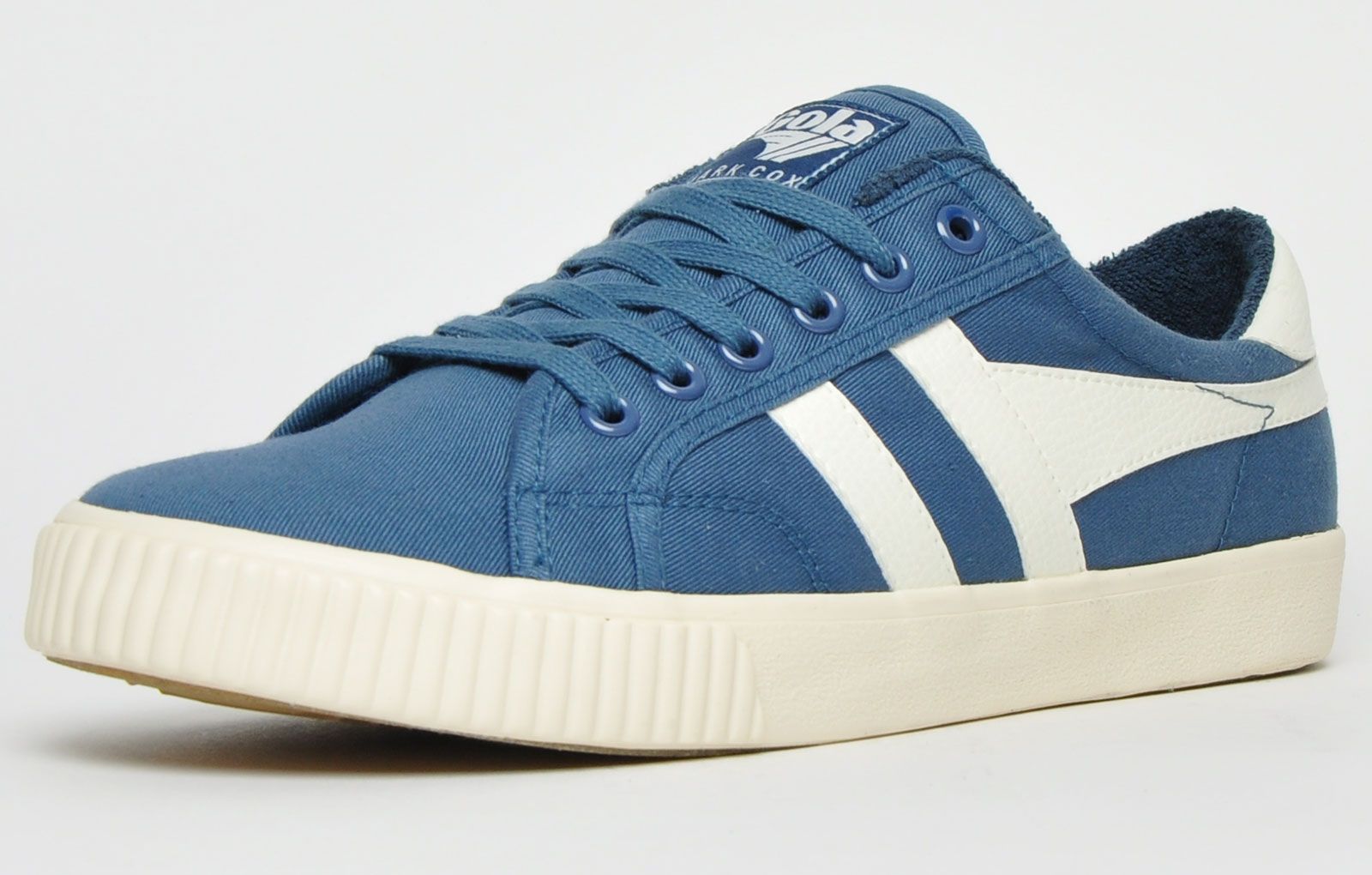 The Gola Classics Tennis Mark Cox is an update of the original Gola Tennis shoe design from 1973. Featuring a Baltic blue canvas textile upper with contrasting Gola branding and a sleek vintage styled sole to give a clean and fresh look. Offering enhanced comfort with a padded soft brushed lining and padded insole, its versatile style can be teamed with a variety of looks to add a relaxed touch to any outfit. <p>- Retro style trainers</p> <p>- Vegan Friendly</p> <p>- Soft lining for additional comfort</p> <p> - Premium canvas textile upper</p> <p>- Lace-up closure</p> <p>- Gola Classics branding throughout</p>