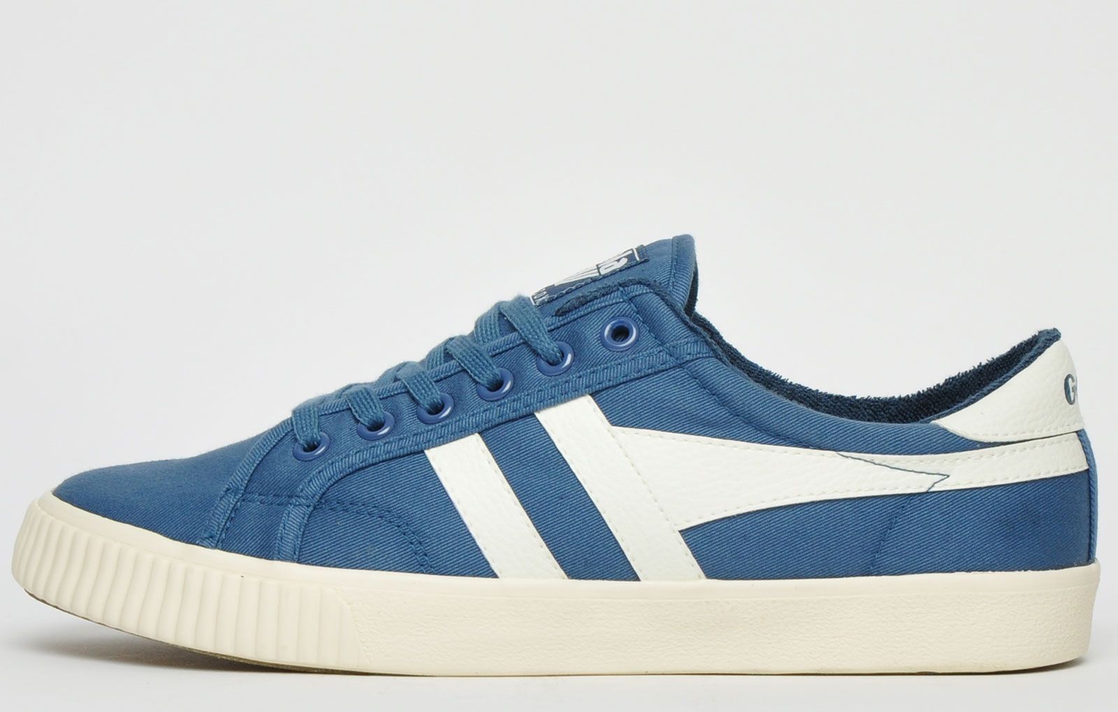 The Gola Classics Tennis Mark Cox is an update of the original Gola Tennis shoe design from 1973. Featuring a Baltic blue canvas textile upper with contrasting Gola branding and a sleek vintage styled sole to give a clean and fresh look. Offering enhanced comfort with a padded soft brushed lining and padded insole, its versatile style can be teamed with a variety of looks to add a relaxed touch to any outfit. <p>- Retro style trainers</p> <p>- Vegan Friendly</p> <p>- Soft lining for additional comfort</p> <p> - Premium canvas textile upper</p> <p>- Lace-up closure</p> <p>- Gola Classics branding throughout</p>