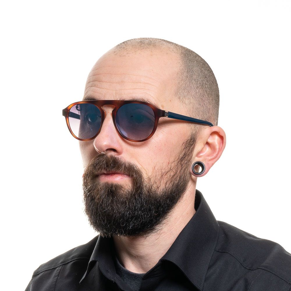 <table><tr><td>Gender</td><td>Men</td></tr><tr><td>Main color</td><td>Brown</td></tr><tr><td>Frame color</td><td>Brown</td></tr><tr><td>Frame material</td><td>Plastic</td></tr><tr><td>Lenses color</td><td>Blue</td></tr><tr><td>Lenses material</td><td>Plastic</td></tr><tr><td>Filter category</td><td>3</td></tr><tr><td>Lenses effect</td><td>Mirrored</td></tr><tr><td>Protection</td><td>100% UVA & UVB</td></tr><tr><td>Size</td><td>51-19-140</td></tr><tr><td>Lenses width</td><td>51mm</td></tr><tr><td>Lenses height</td><td>41mm</td></tr><tr><td>Bridge width</td><td>19mm</td></tr><tr><td>Frame width</td><td>136mm</td></tr><tr><td>Temples length</td><td>140mm</td></tr><tr><td>Spring hinge</td><td>No</td></tr><tr><td>Style</td><td>Oval</td></tr><tr><td>Shipment includes  </td><td>Case, cleaning cloth</td></tr></table>