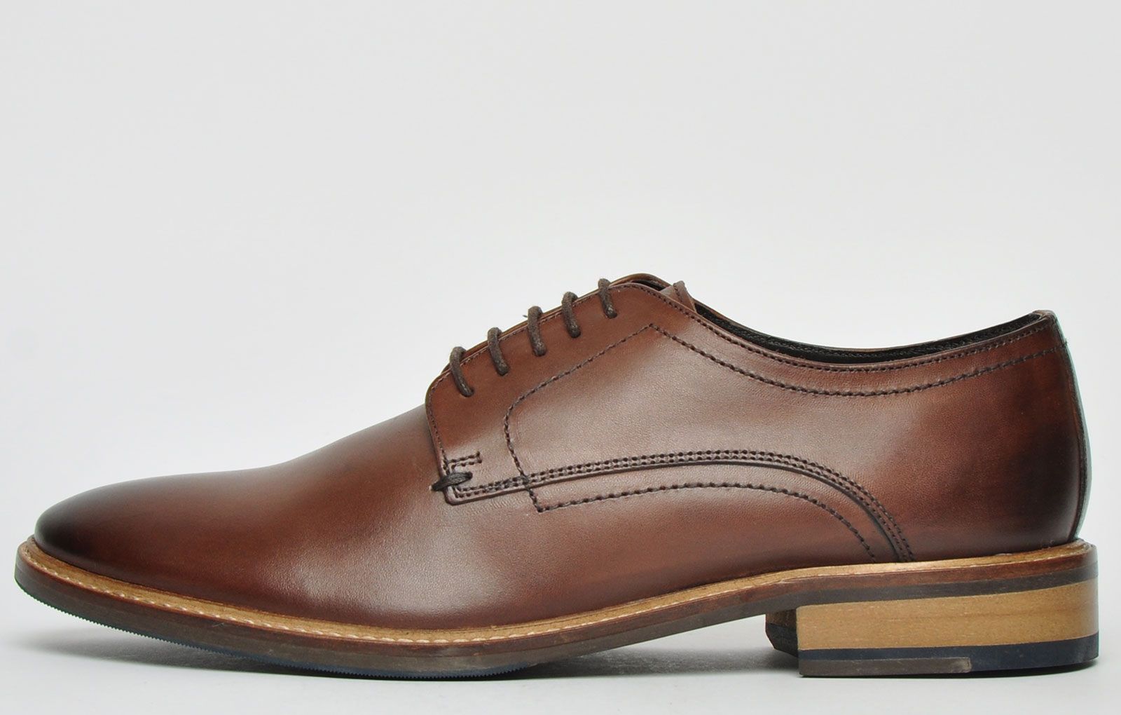 Crafted from quality soft leather in a well sought-after brown colourway, the Conrad has a smooth finish that would upgrade a smart look or add an elegant touch to any smart-casual outfit. <p>These Ikon Conrad men’s premium leather shoes feature a full lace up front, combined with a premium leather textile inner lining, providing a comfortable and secure fit throughout all wear. The durable outsole with stitch detailing provides fashionable retro styling making these Conrad shoes an absolute fashion must have<b>.</b></p> <p><b> </b></p> <p style=