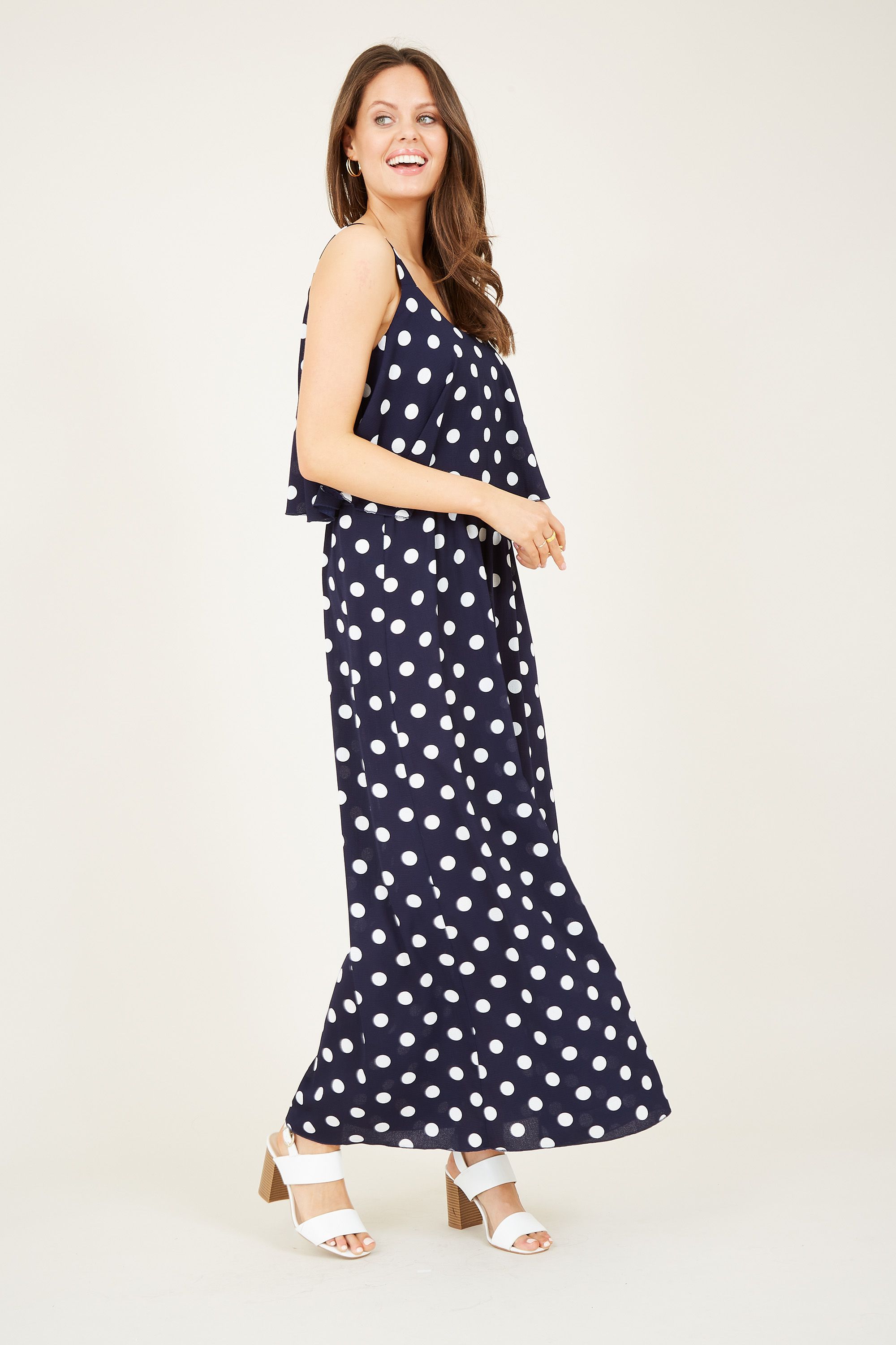 Inject a touch of print to your wardrobe with this Mela Spotted Maxi Dress. Complete with the relaxed style you know and love, it&rsquos been updated with a draping spotted fabric below the bust. The thick straps give it maximum support, whilst the monochrome palette is on-trend for the season. Dress it up or down with ease.  Shell: 100% Polyester Machine Wash At 30 Length 126cm Model Wears Size 10
