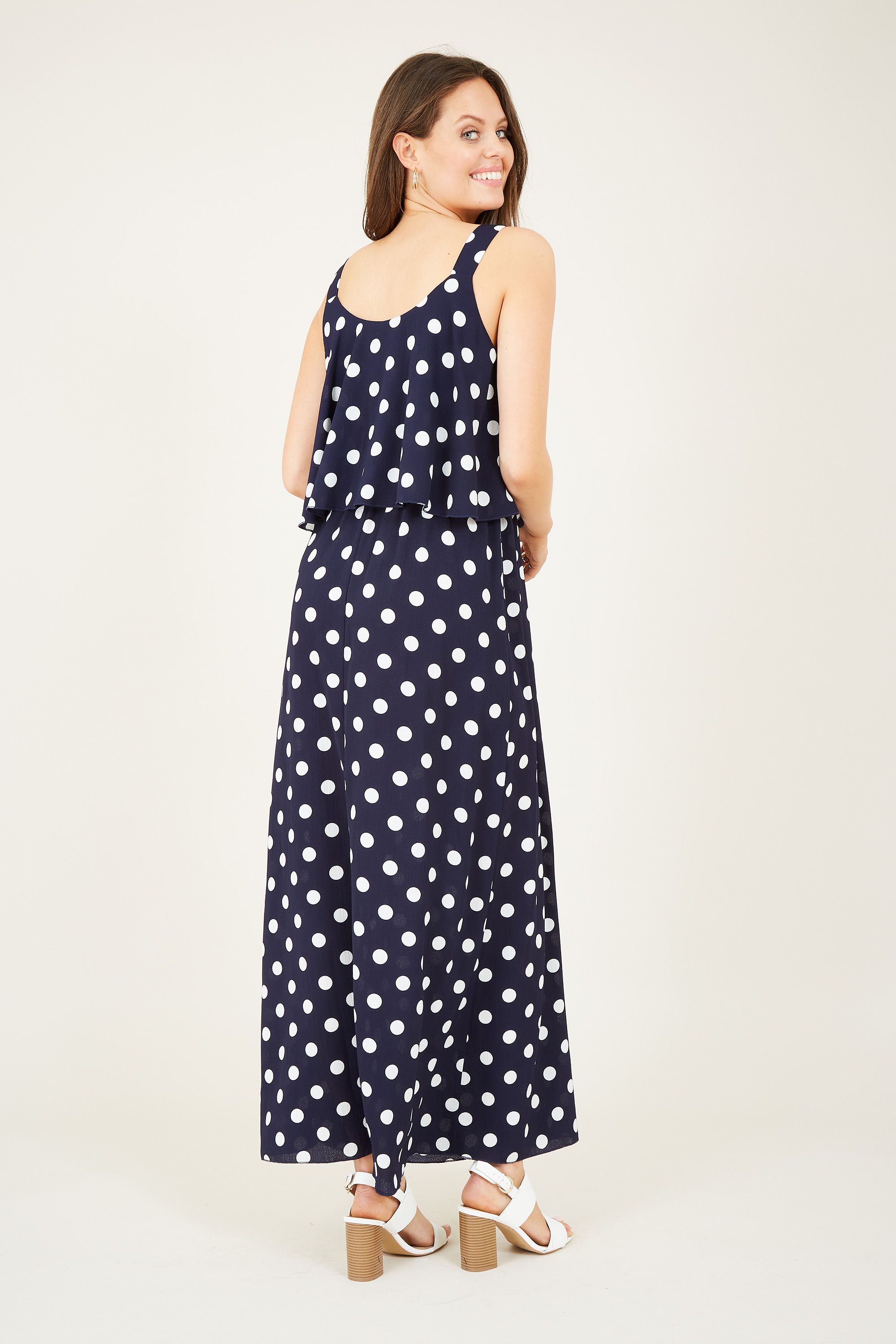 Inject a touch of print to your wardrobe with this Mela Spotted Maxi Dress. Complete with the relaxed style you know and love, it&rsquos been updated with a draping spotted fabric below the bust. The thick straps give it maximum support, whilst the monochrome palette is on-trend for the season. Dress it up or down with ease.  Shell: 100% Polyester Machine Wash At 30 Length 126cm Model Wears Size 10