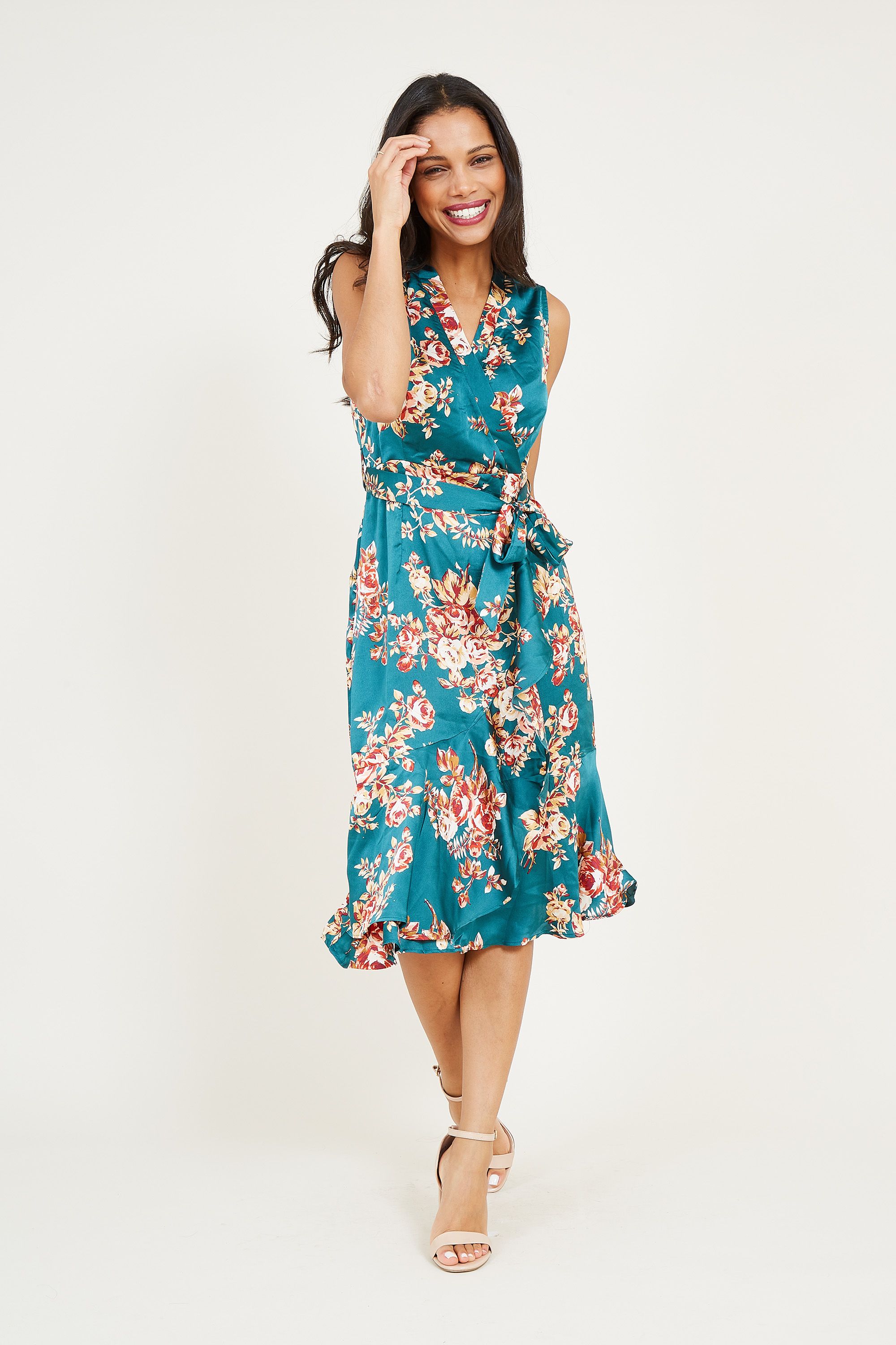 In a vivid shade of green, this Mela Floral Satin Midi Dress offers a timeless touch to your wardrobe. Floating below the knee, this versatile dress is designed with a relaxed shape that cinches at the waist. The slinky fabric offers a luxurious feel, printed with colourful florals for the perfect finish. Accessorize with metallic heels for parties and off-duty evenings.
