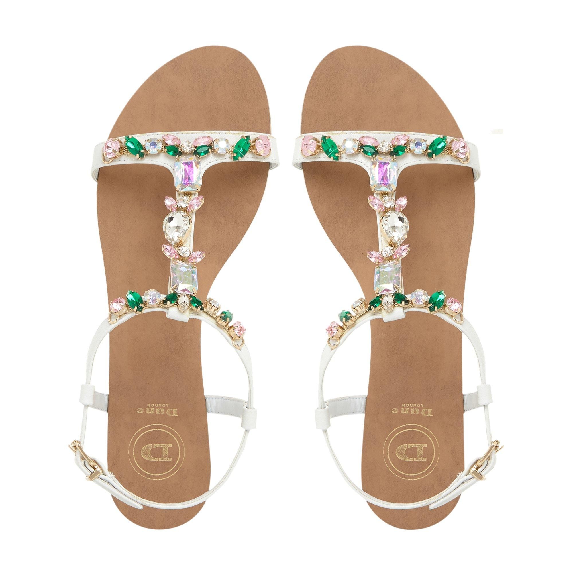 Complete your summer edits with the versatile Natally sandal by Dune. Secured with a gold-toned buckle fastening, it sits on a low block heel. The exquisite stone accents add a sparkling finish and a hint of glamour.