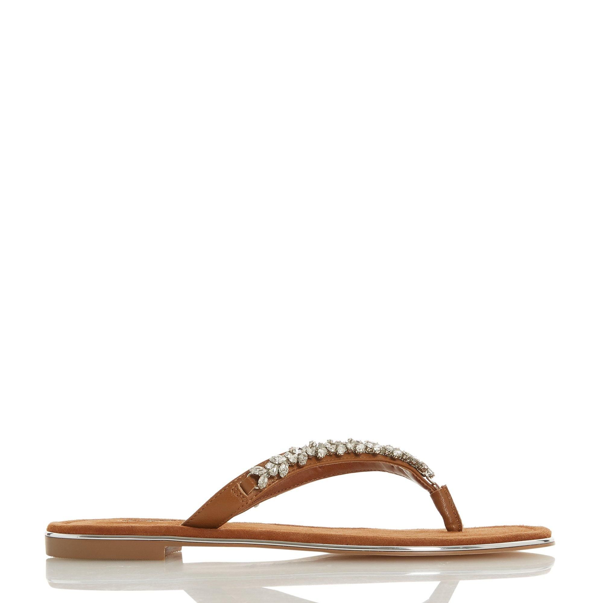 Make a sparkling addition to your summer edit with the Newbey sandal. Showcasing a diamante-encrusted toe post and a low block heel. Silver-tone trims completes this easy slip-on design.