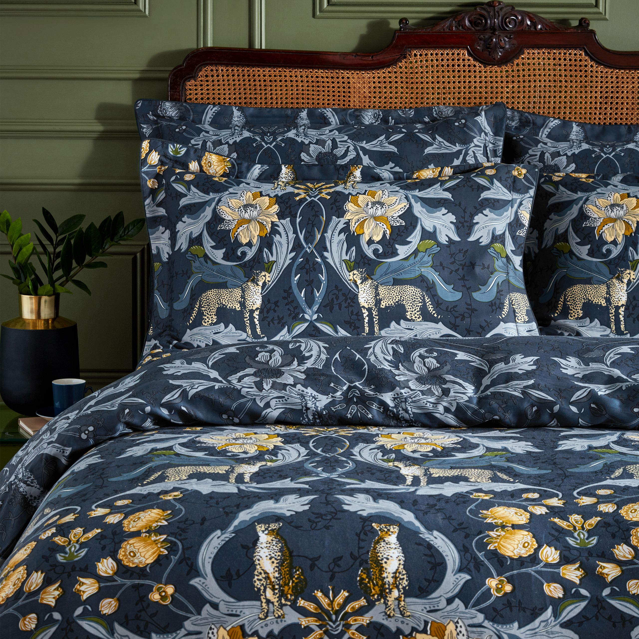 Inspired by Art Nouveau botanical illustrations, Nouvilla is a highly decorative design featuring charming cheetahs amongst meandering curves of plants and flowers. This luxury cotton sateen bedding features contrast piping, oxford edge pillowcases and a tonal coordinating print on the duvet cover reverse. This duvet cover set has been produced to a meticulous standard, with a thread count of 200 threads per square inch, to ensure a soft, smooth and long-lasting fabric.