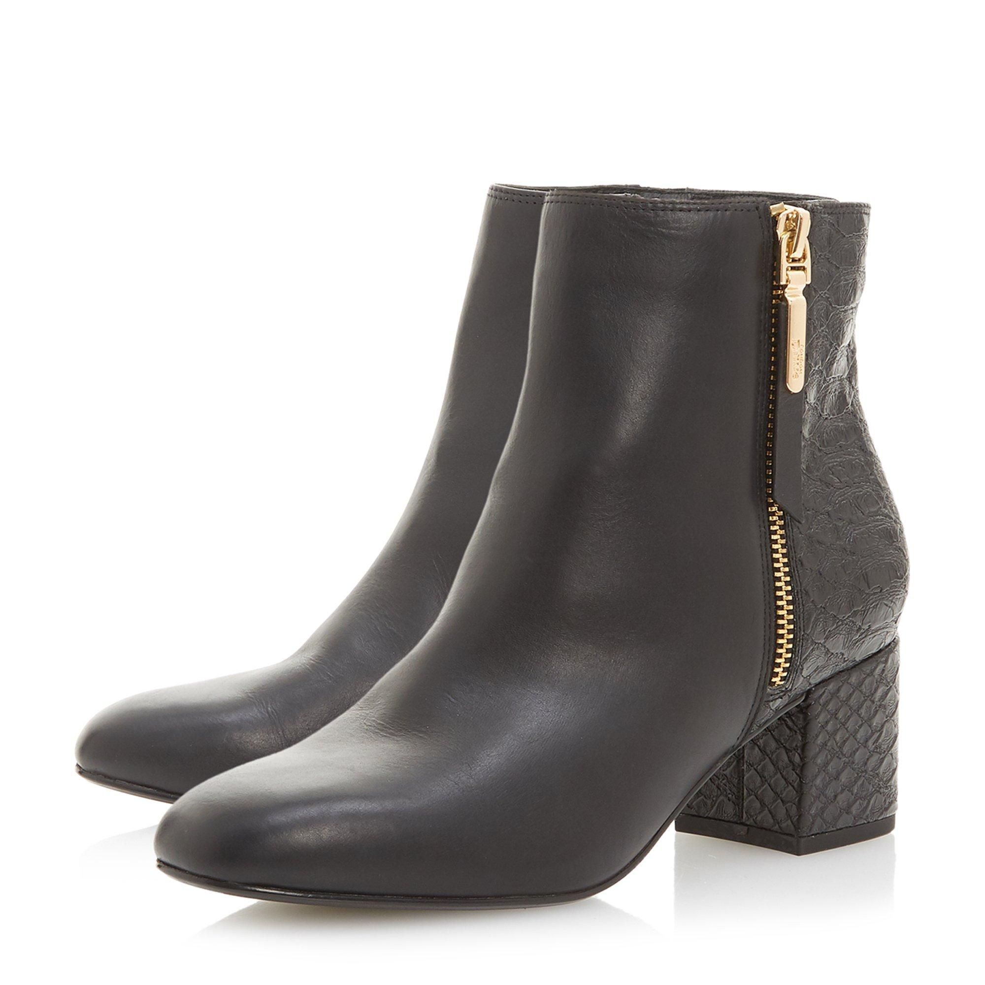 This Orrla ankle boot by Dune London is an everyday essential style. The sleek side zip silhouette features a round toe and a low heel. Great for both day and evening, it's the perfect fit for any outfit.