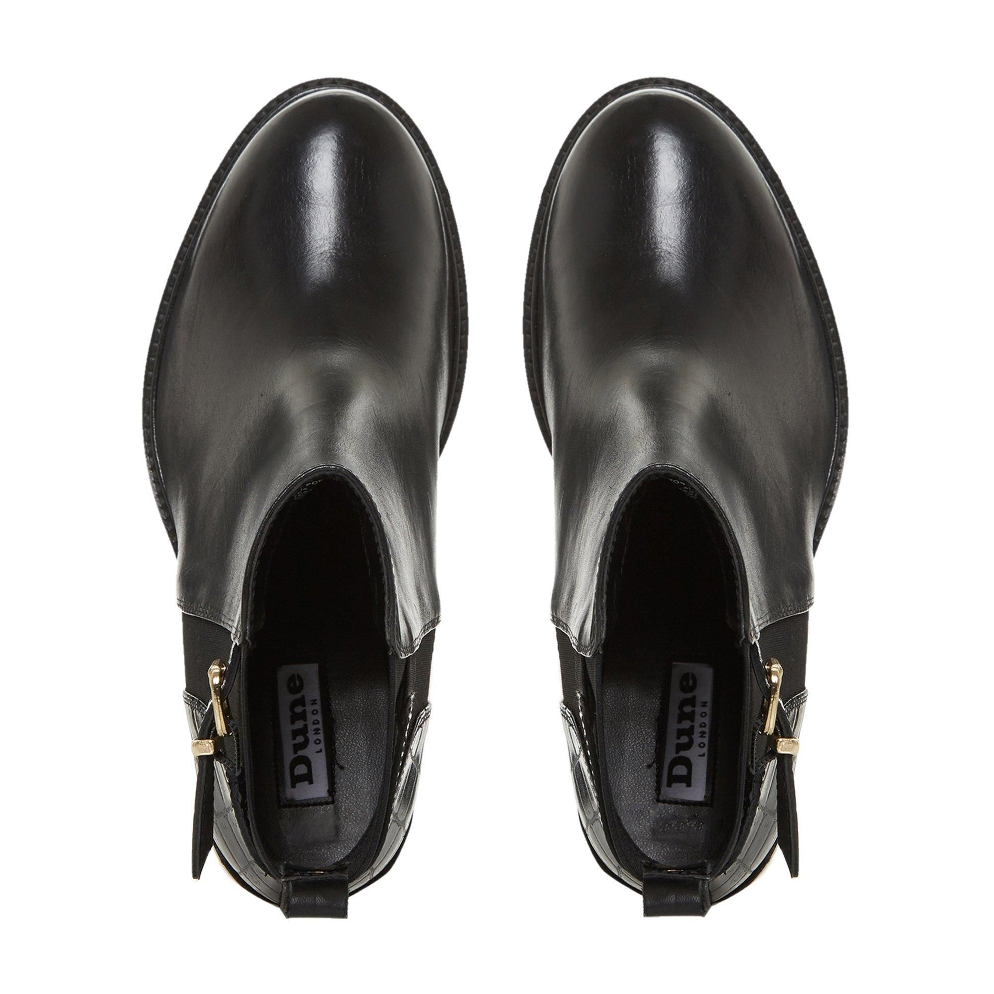 Elevate your smart-casual edit with the Poetics ankle boots. An update on the classic Chelsea with a buckle detail and high block heel. Fitted with a round toe, it also has elasticated inserts for a comfy fit.