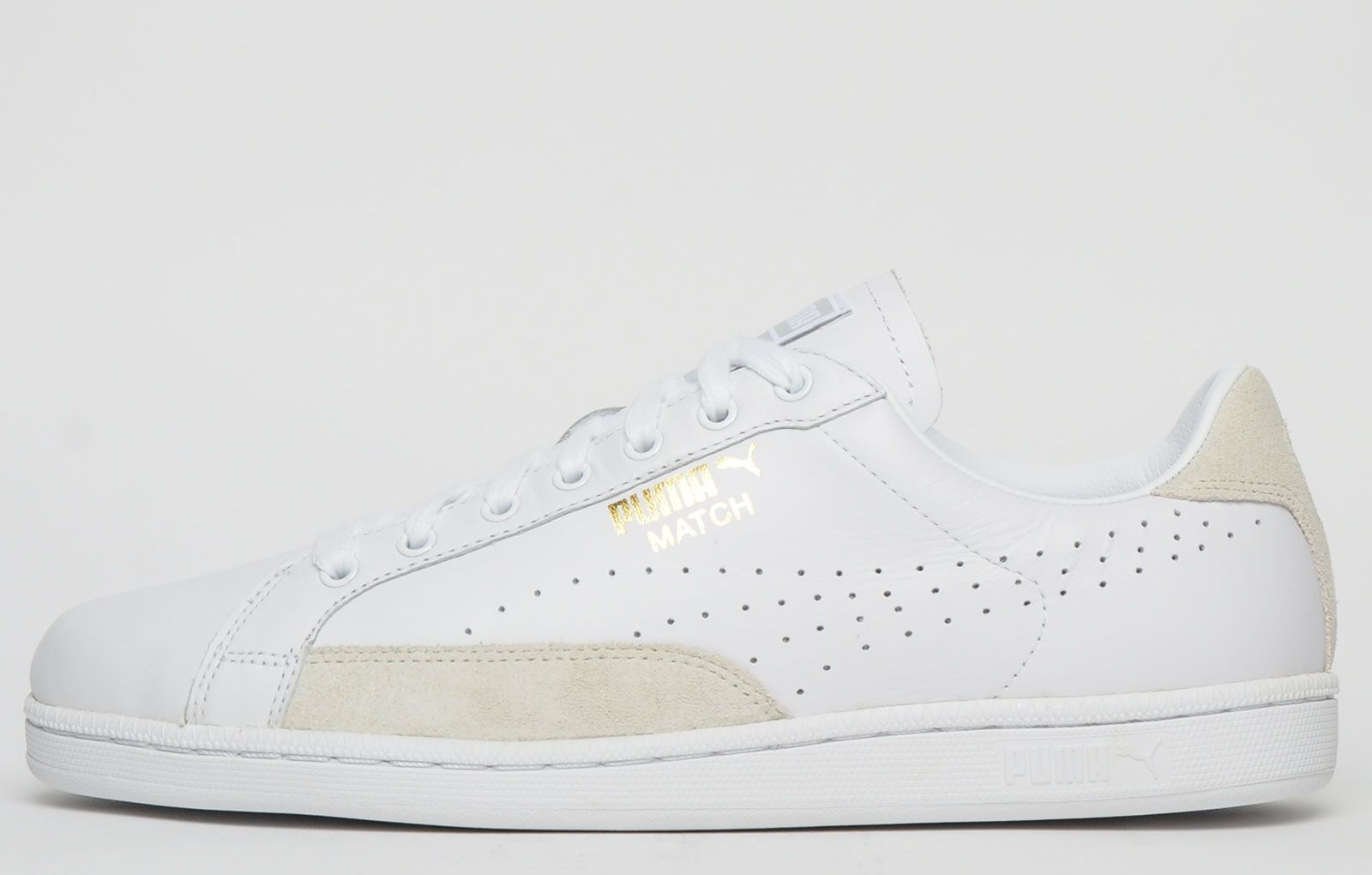 <p>The Puma Match 74 UPC from the iconic 1974 tennis collection features a soft leather upper with side perforations for breathability with the addition of suede panelling to the sides and heel with gold Puma branding to the side to complete the look.</p> <p>The Match 74 men’s shoe is finished off with a durable rubber sole with a textured vintage styled finish which will provide stability and grip on all surfaces and with a slimmed down look to give that sporty designer feel</p><br> <p class=