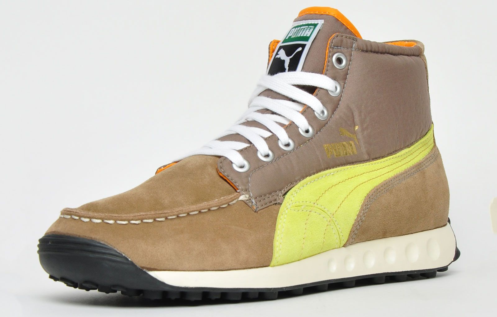 The Puma Easy Wing L Mashup is a fashionable and durable trainer boot that's perfect for the coming season. <p>Puma have adeptly transformed their popular Puma Easy Rider trainer into a stylish boot. They feature a quality nubuck leather nylon and synthetic mixed upper complimented with contrast metal eyelets and iconic Puma Formstripe branding adorned to the side of the upper for instant brand recognition.</p> <p>These trainers are further enhanced with a premium cushy midsole and a lug treaded outsole designed to offer supreme traction across a multitude of surfaces </p> <p>- Premium nubuck leather / nylon / synthetic mix upper </p> <p>- Trainer boot construction </p> <p>- Secure up-front lace up closure </p> <p>- Contrast metal eyelets</p> <p>- Supportive and cushioned EVA midsole </p> <p>- Durable lug treaded rubber outsole offers grip </p> <p>- Puma branding throughout </p>