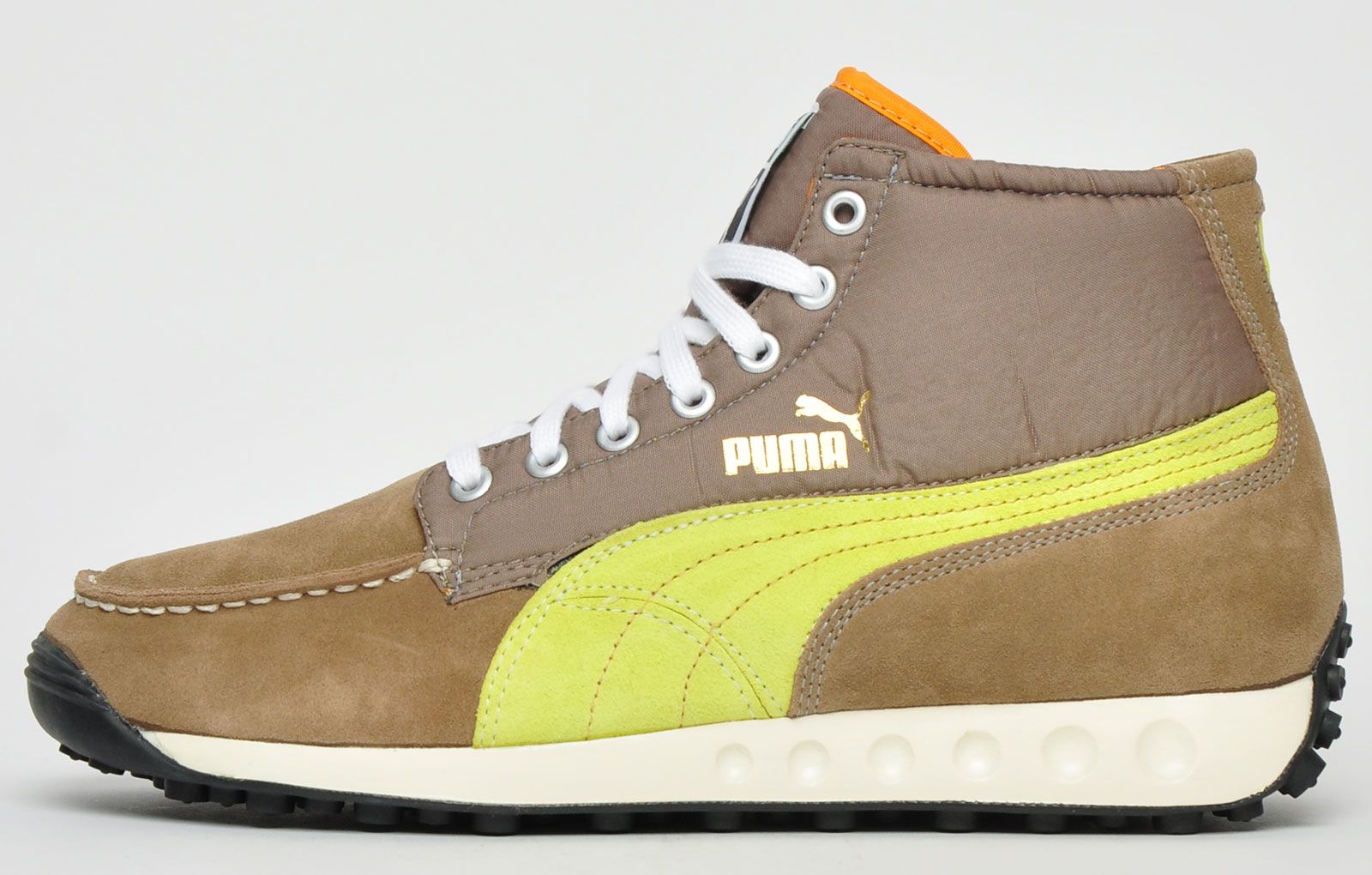 The Puma Easy Wing L Mashup is a fashionable and durable trainer boot that's perfect for the coming season. <p>Puma have adeptly transformed their popular Puma Easy Rider trainer into a stylish boot. They feature a quality nubuck leather nylon and synthetic mixed upper complimented with contrast metal eyelets and iconic Puma Formstripe branding adorned to the side of the upper for instant brand recognition.</p> <p>These trainers are further enhanced with a premium cushy midsole and a lug treaded outsole designed to offer supreme traction across a multitude of surfaces </p> <p>- Premium nubuck leather / nylon / synthetic mix upper </p> <p>- Trainer boot construction </p> <p>- Secure up-front lace up closure </p> <p>- Contrast metal eyelets</p> <p>- Supportive and cushioned EVA midsole </p> <p>- Durable lug treaded rubber outsole offers grip </p> <p>- Puma branding throughout </p>