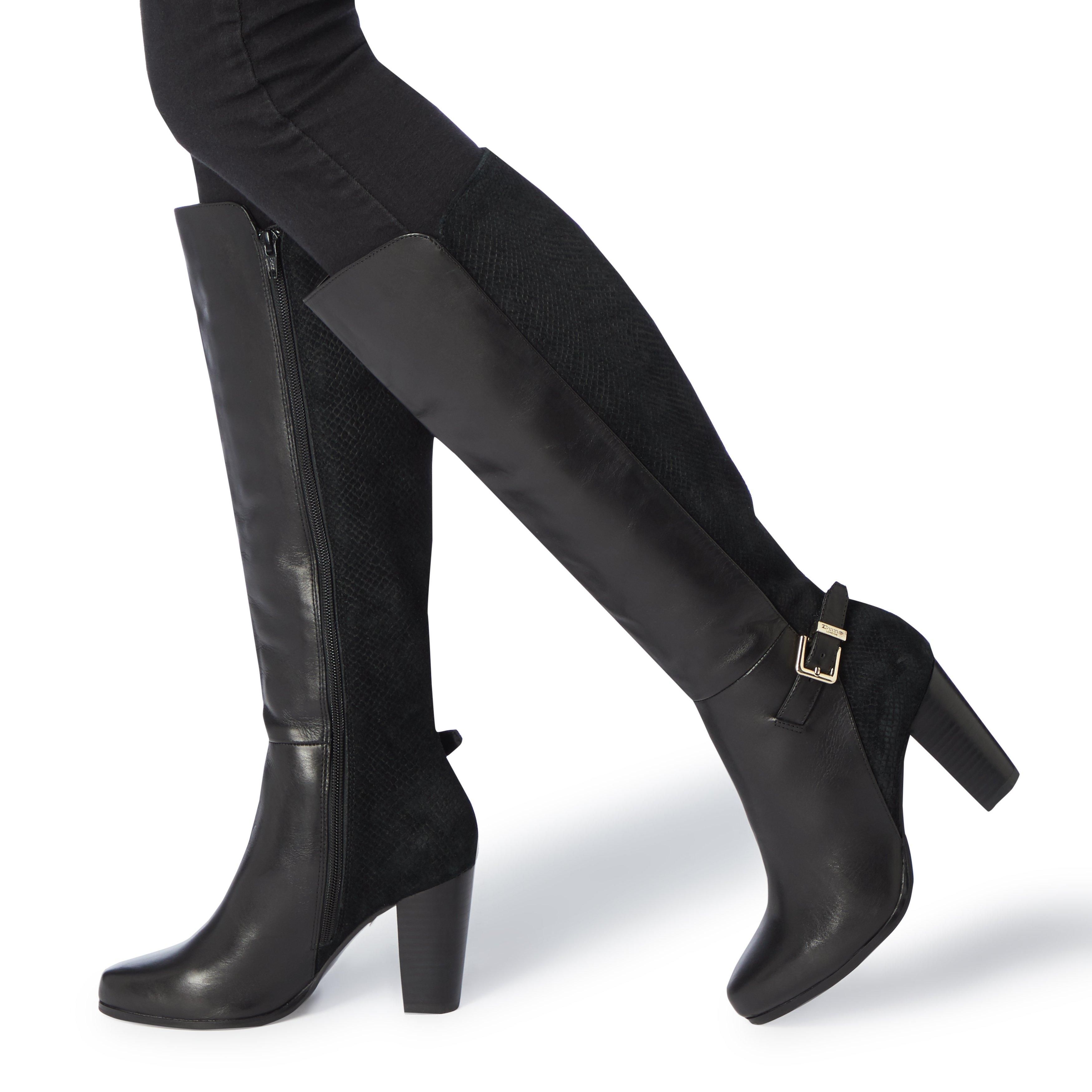 This Dune London Samuella knee high boot is a stunning daywear style. Featuring an almond toe, buckle strap trim and a high chunky heel. A side zip closure completes this ultra versatile mixed fabric design.