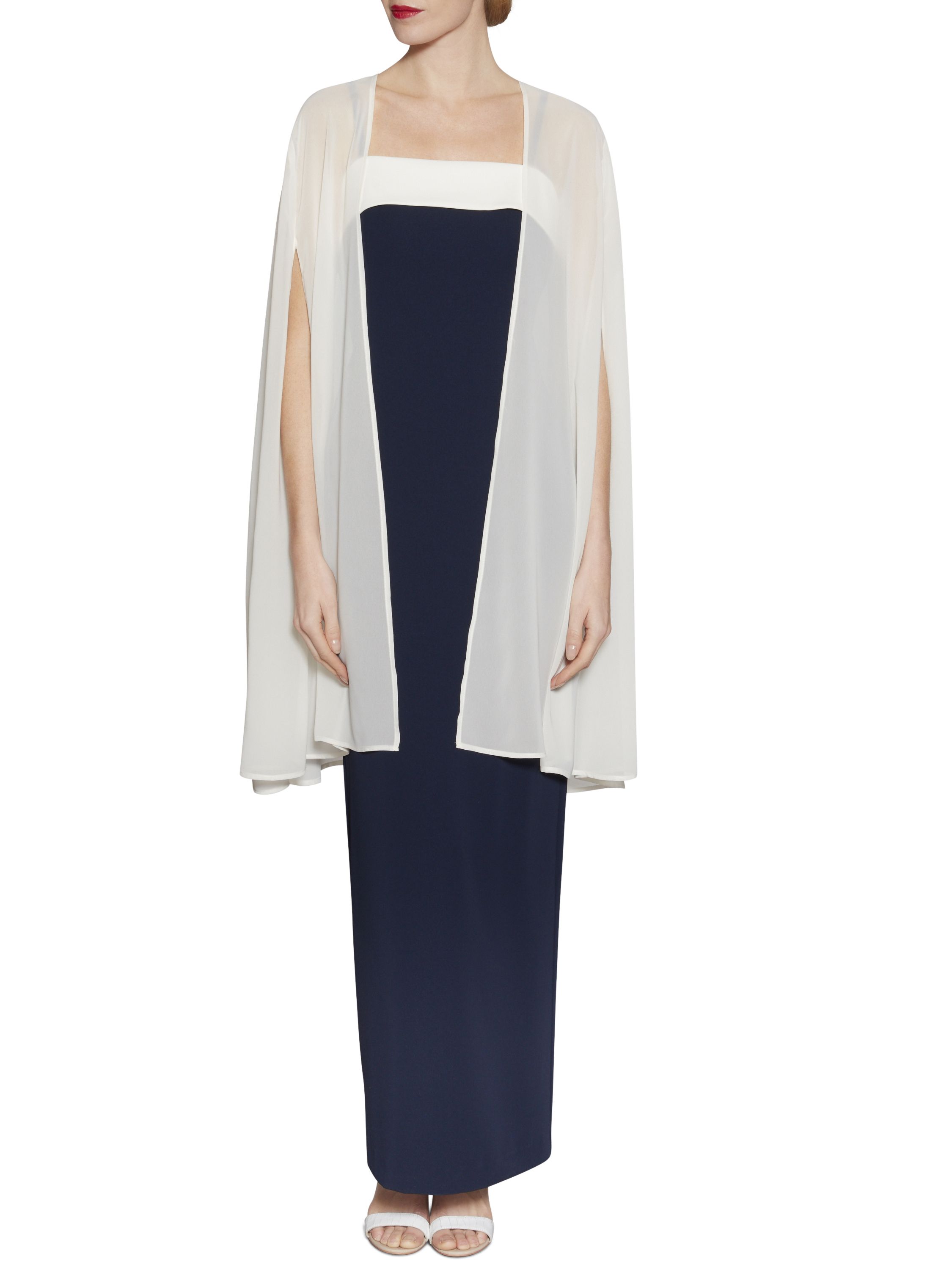 Complete any evening look and feel stunning on those chilly nights with this chiffon cape by Gina Bacconi. The cape is made out of chiffon and is crafted to sit effortlessly on the shoulders. Long and elegant, the cape features armholes for ease of movement. The perfect cover up for any dress.