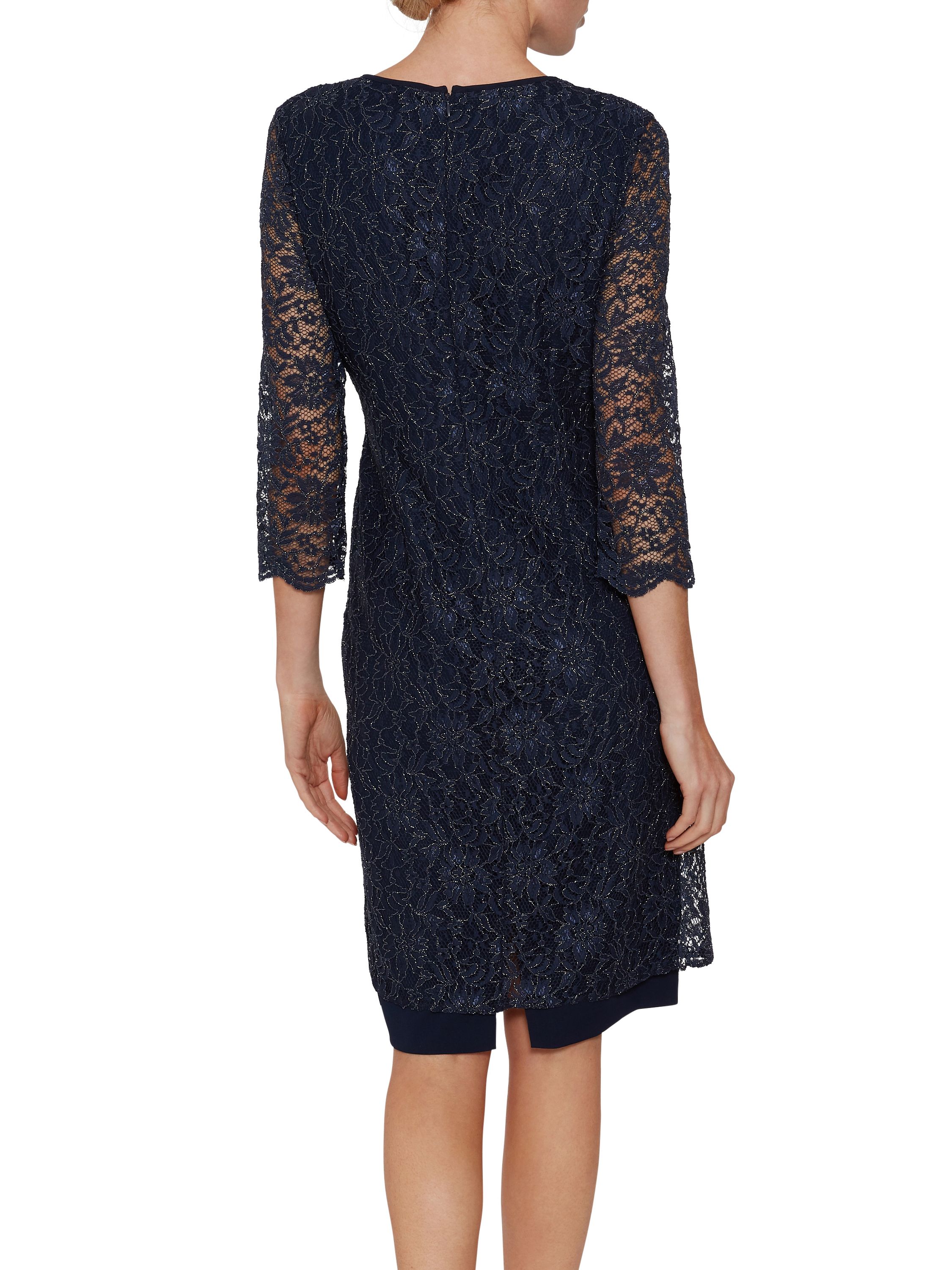 Gina Bacconi presents its stunning crepe and lace dress. This perfect occasionwear piece is comprised of a classic shift dress overlaid with a luxurious stretch lace. The lace features a scallop lace which adorns the front of the dress and the sleeve edge.The dress is fully lined and fastens using a concealed back zip.
