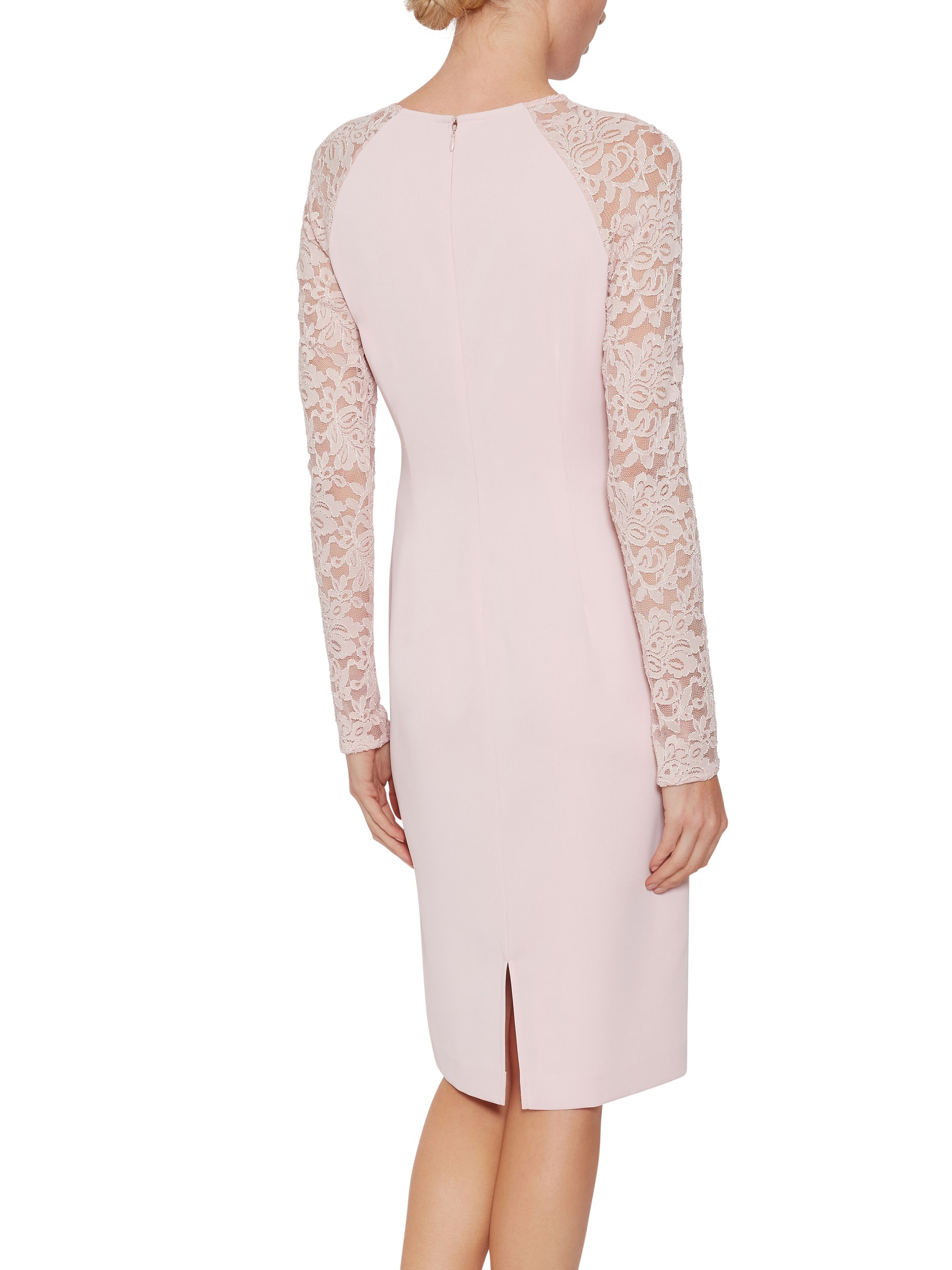Gina Bacconi presents its stunning crepe and lace dress. This perfect occasionwear piece is comprised of a classic shift dress with sheer dainty floral lace sleeves. This beautiful dress is perfect for a summer party or special occasion. The dress is partially lined and fastens using a concealed back zip.