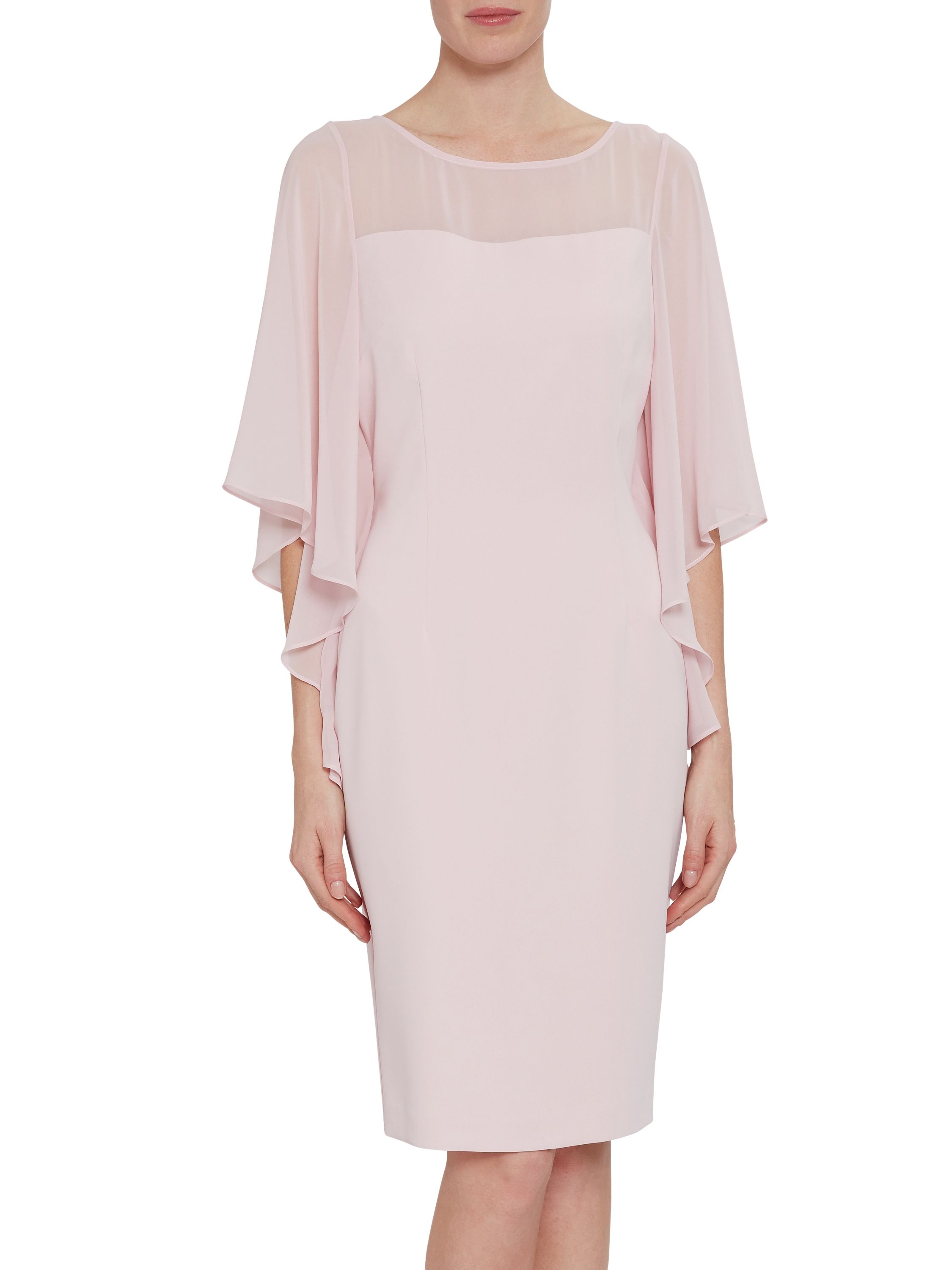 Feel stunning in this gorgeous dress by Gina Bacconi. This beautifully fitted jersey dress has cape like sleeves which flow gracefully at the sides of the bodice. It features elegant gathering on the left hand side on the dress both of the front and back of the dress creating a feminine silhouette. This dress is fully lined and has a buttoned keyhole fastening.
