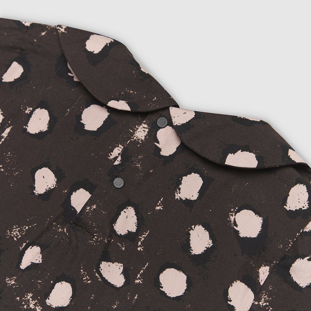 Lightweight 100% cotton dress with our bespoke painted dot print in brown with pink and black dots. Features a Peter Pan Collar and press stud back opening for ease of dressing.