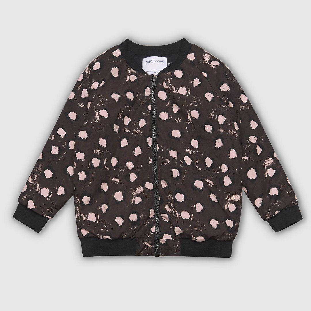 Lightweight cotton bomber jacket in brown featuring our all over painted dot print in pink and black. Inside lining and ribbed collar in matching black jersey to give our little ones extra warmth and comfort. Features zip opening front for ease of dressing and front pockets. Designed to be unisex.