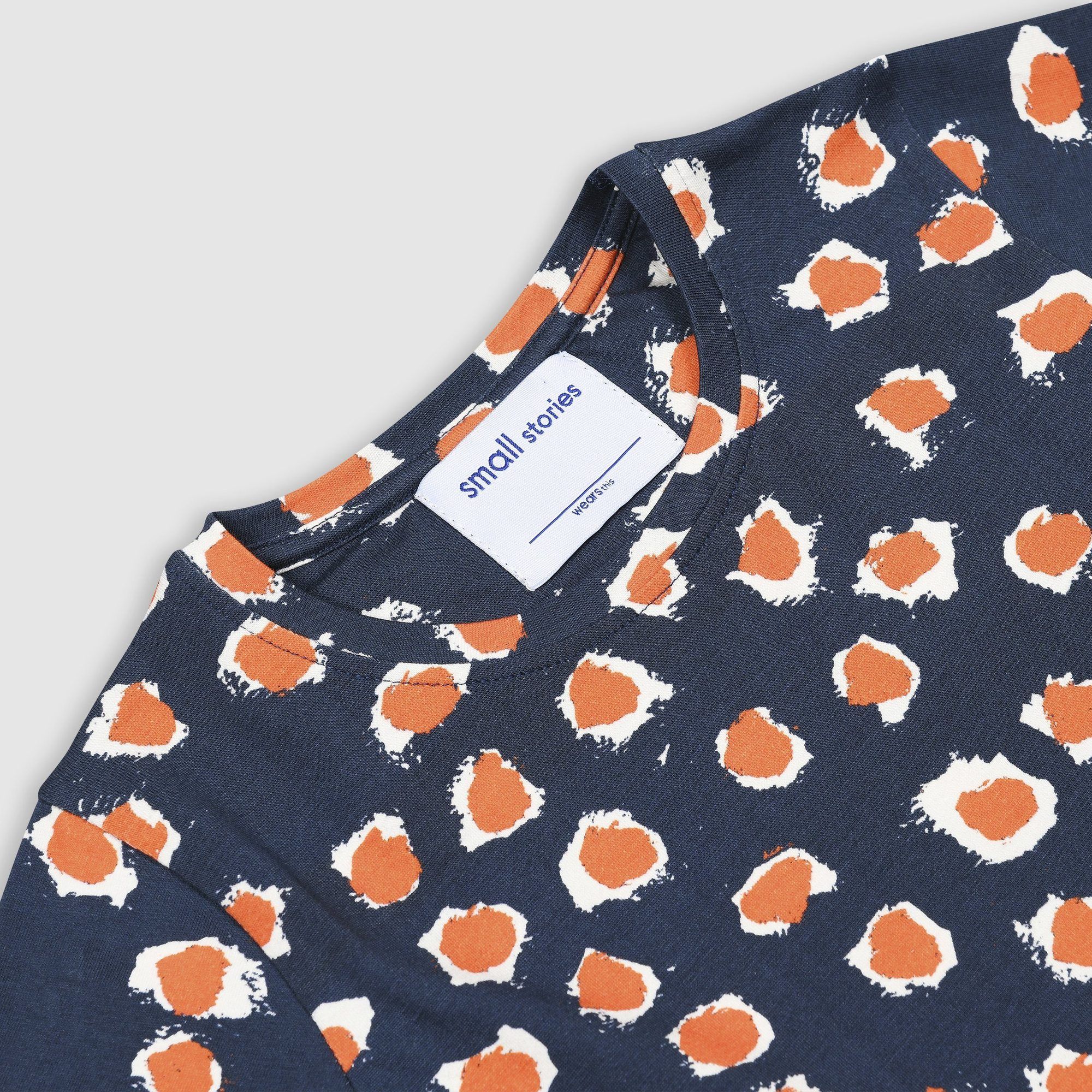 Short sleeve jersey dress with drop waist in our bespoke painted dot print in blue with orange and white dots. Made from super soft stretchy cotton.