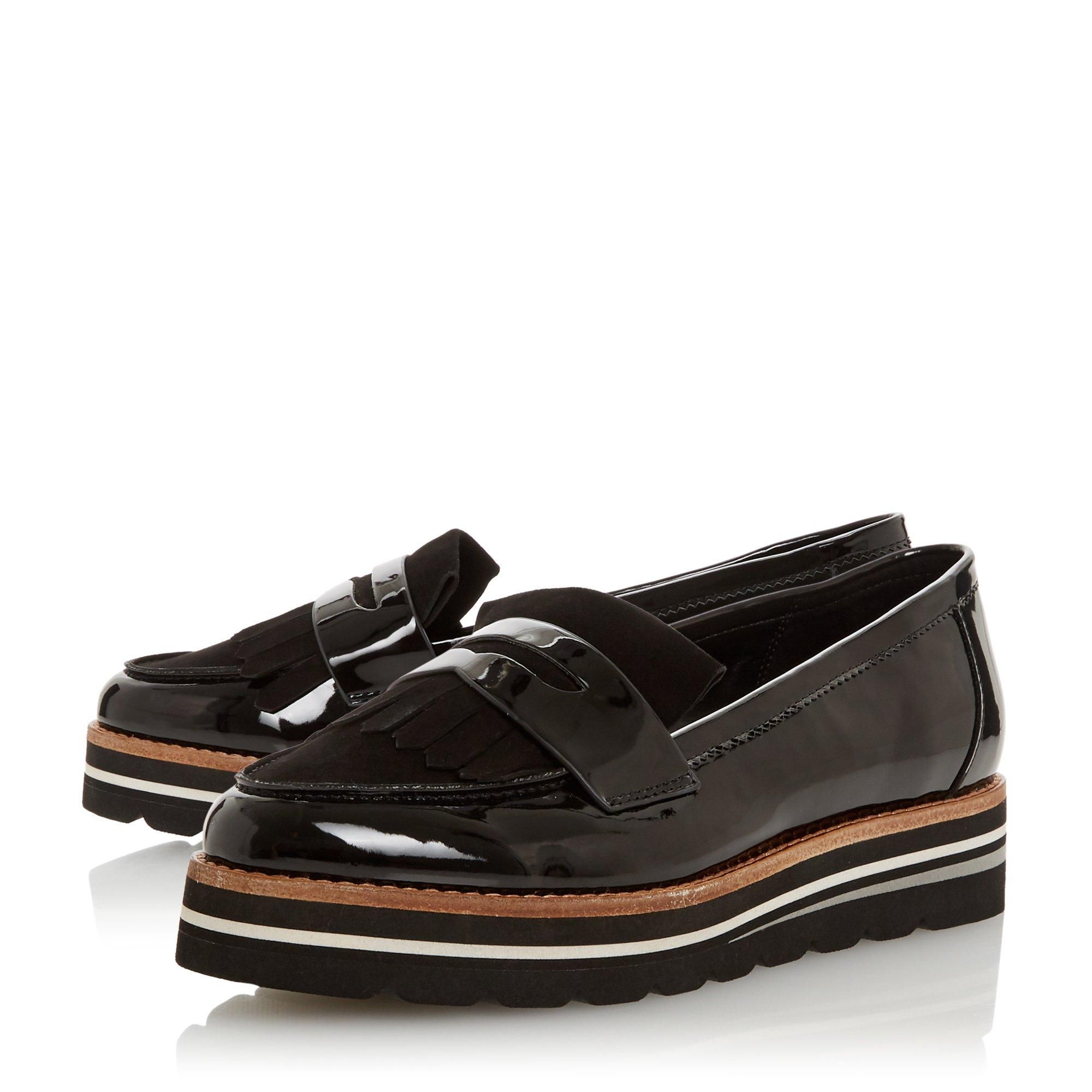 Create chic daytime looks with the Gracella loafer from Dune London. Resting on a flatform heel, it features smart apron detailing. It is complete with a fringed trim and a timeless saddle strap.