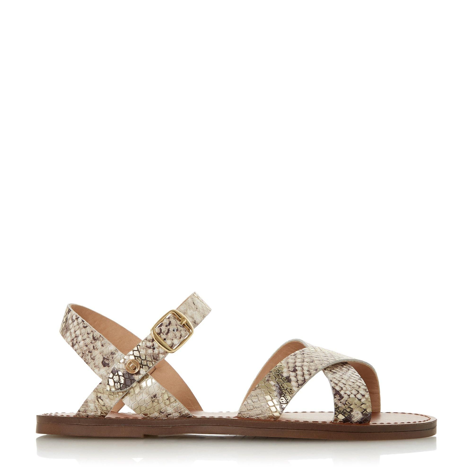 Upgrade your summer style with the WF Lavell sandal by Dune London. Designed with chic cross-over straps and a comfortable flat sole. It's complete with an ankle strap and gold-tone buckle fastening.