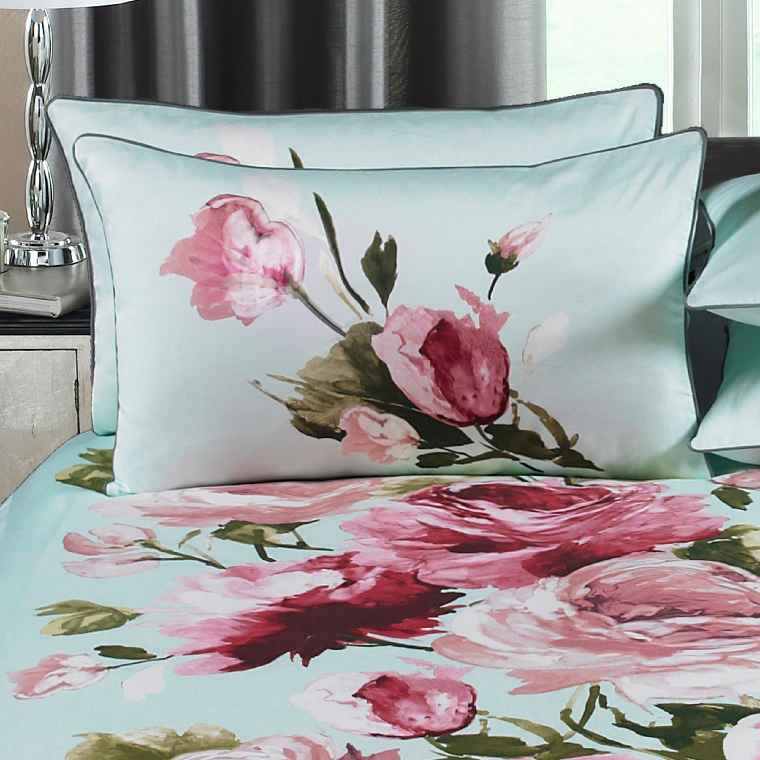With its strong oriental inspiration, add a burst of floral luxury to your bedroom with the Windsor duvet cover set. Created from the highest quality, 300 thread count sateen cotton, both the duvet cover and pillowcases are silky soft, making it an absolute pleasure to tuck yourself into each night. The large scale floral bloom dominates this beautiful bed linen, which will instantly transform the look in any bedroom setting to create a colourful, vibrant interior display. Each duvet has a secure button closure and comes with fully matching envelope-style pillowcases. For the best finish machine wash at 60 degrees and iron on a hot setting.
