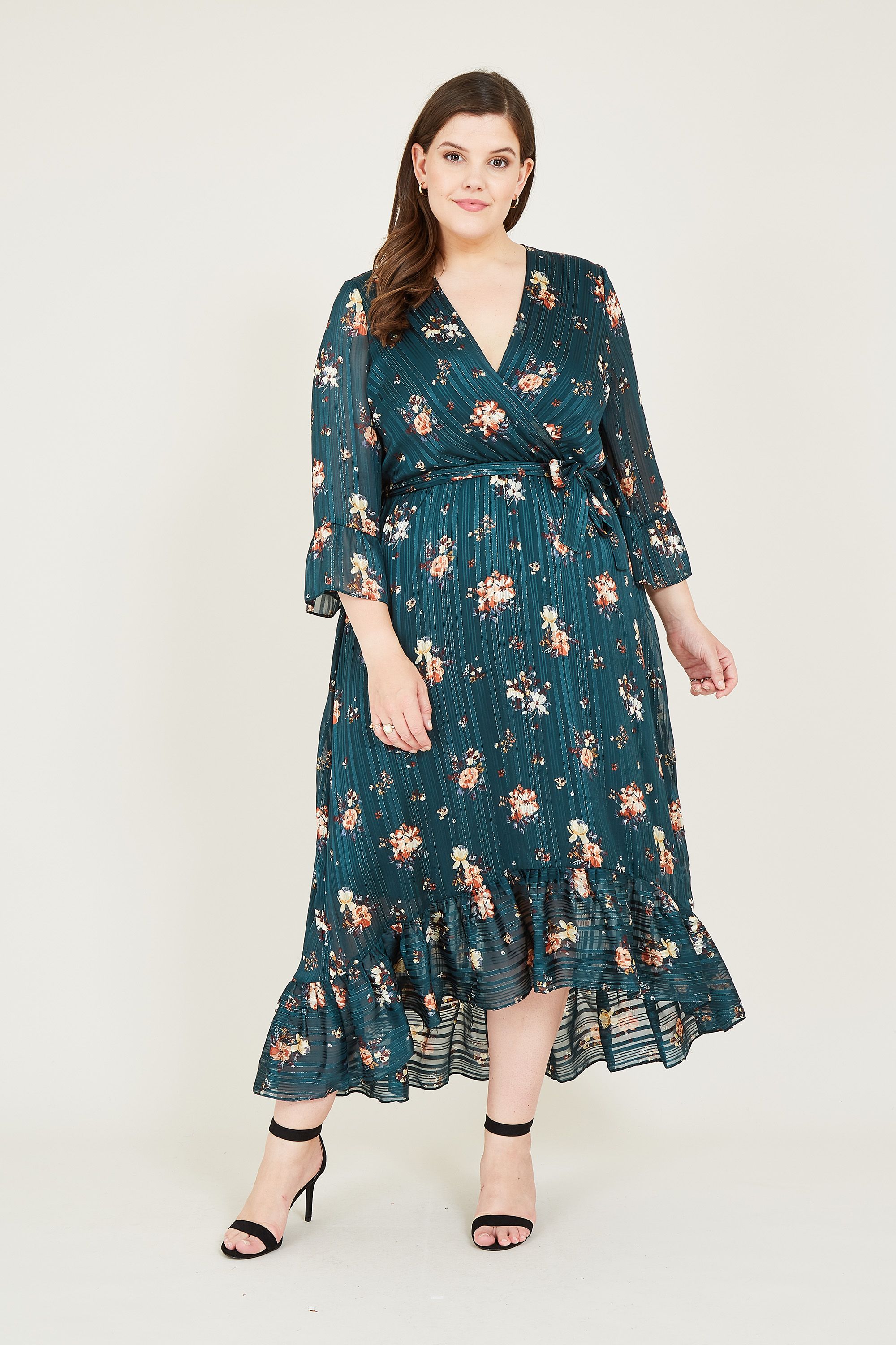 Fancy a new fancy dress? Opt for our Plus Size Floral Lurex Midi Dress. Featuring a plush asymmetric hemline and long sleeves for balance, this party dress is crafted from luxurious lurex. The pretty floral print adds an eye-catching twist, complemented by the framing nape button and tie waist. Look good from every angle when you pair with heels.
