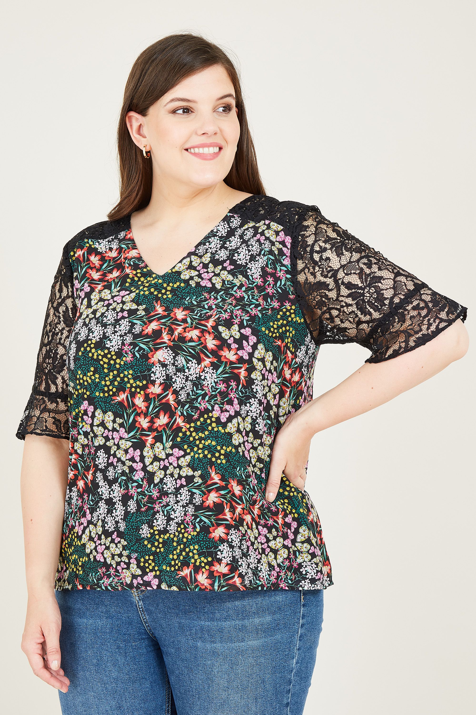 Elevate your day-to-night collection with our Plus Size Butterfly Lace Top. With a relaxed silhouette and a soft-touch feel, this versatile top features a flattering t-shirt shape. Enhanced by a plush print, it’s styled with lace sleeves and a nape button to finish.