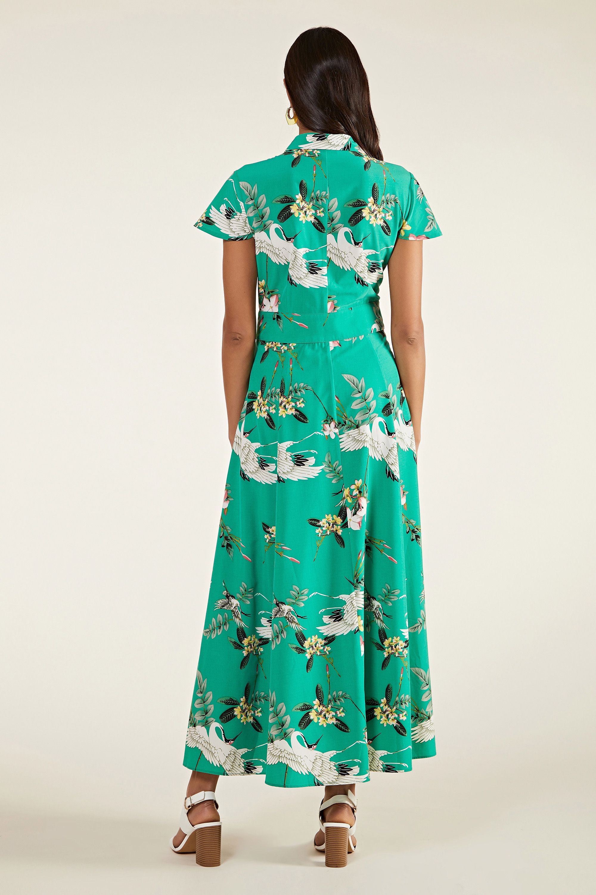 A look with high impact, this Bird Print Maxi Dress will inject your wardrobe with invigorating colour. Draping to the ankle, it's designed with a shirt bodice and a flowing skirt. Faux-pearl buttons run through the silky-soft fabric, detailed with an iconic crane print. The perfect dress for those warm holiday evenings, dress it up with block heels and a statement clutch. 100% Polyester. Machine Wash At 30. Length is 135cm/53inches.