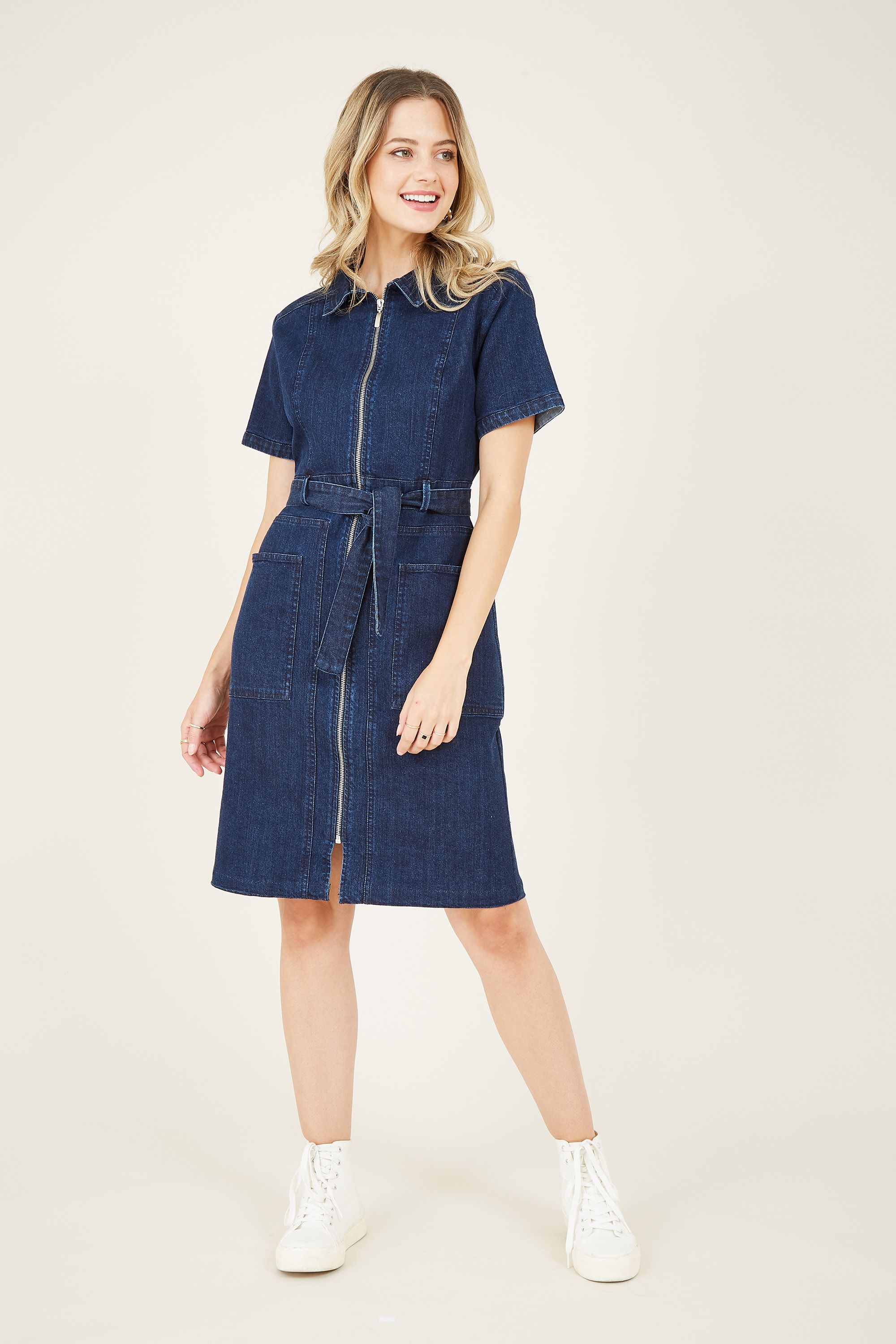 An easy alternative to jeans, our Denim Zip Shirt Dress is a timeless classic you will wear over and over. With a knee-length design, it's semi-fitted with a tie waist and a modern zip running down the front. With practical pockets sat on the hips, the cotton fabric brings heaps of comfort to your off-duty look.