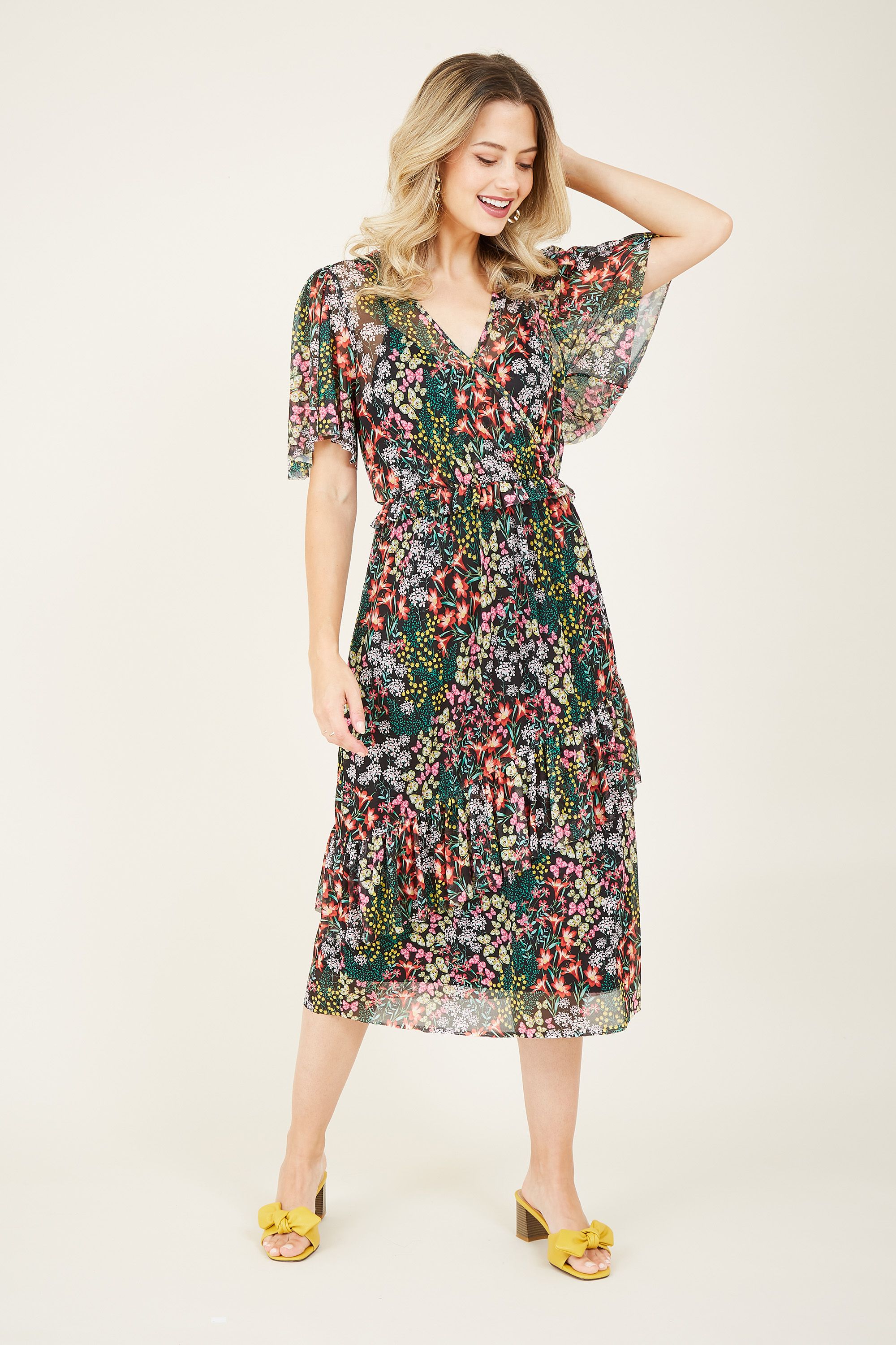 An effortless choice for off-duty moments, this Butterfly Mesh Maxi Dress is a cut above the rest. Skilfully designed with a light, sheer mesh, this modern dress is detailed with a sweet butterfly print. Ruffled sleeves and a fitted waist offer a flattering silhouette, with the wrap bodice creating a feminine finish.