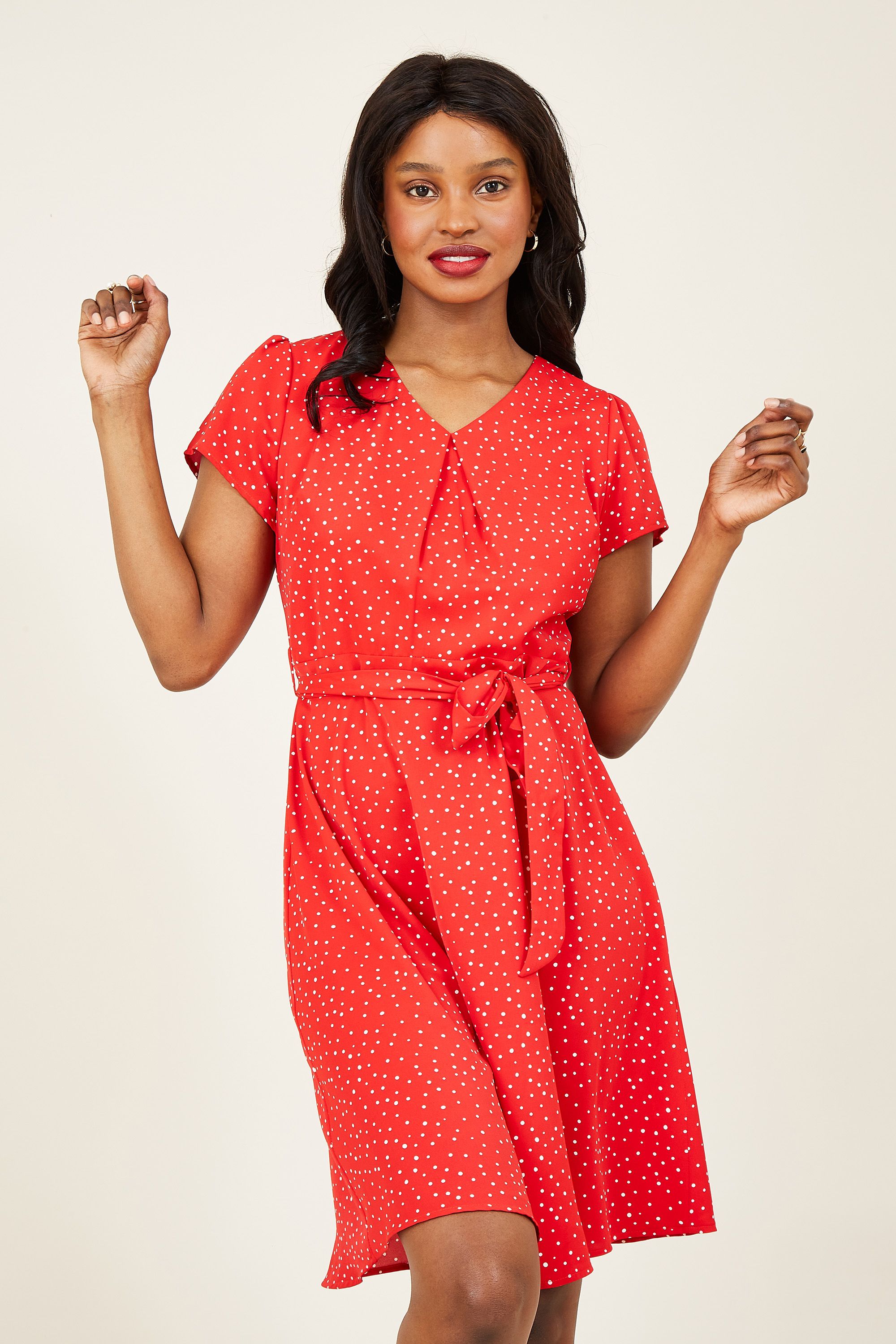 Our fail-safe Spot Skater Dress is the daytime to dinner piece. Showcasing a ditsy spot print flowing through soft polyester, it's cut in the fit and flare shape you adore. A V-neckline keeps profile look balanced, with a zip fastening on the back to finish. Dress it up with heels and a clutch.