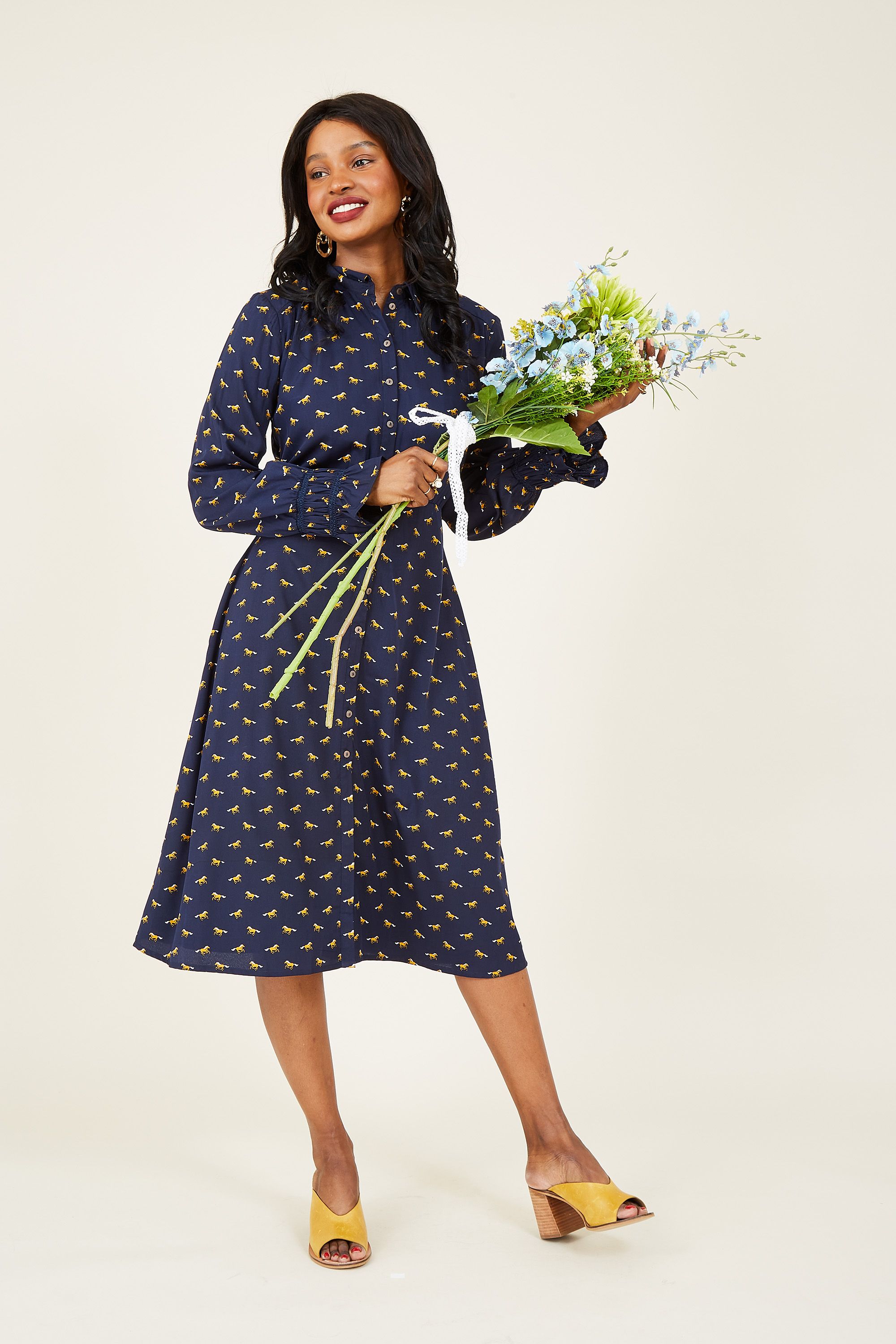 If you're an animal lover, you'll want to take a closer look at our Horse Shirt Dress. Packed with utility details, it's designed with long cuffed sleeves, a relaxed collar and buttons on the front. A flattering waist tie runs around the waist to secure your shape, whilst the soft fabric gives it a casual edge. Dress it down with a pair of boots.