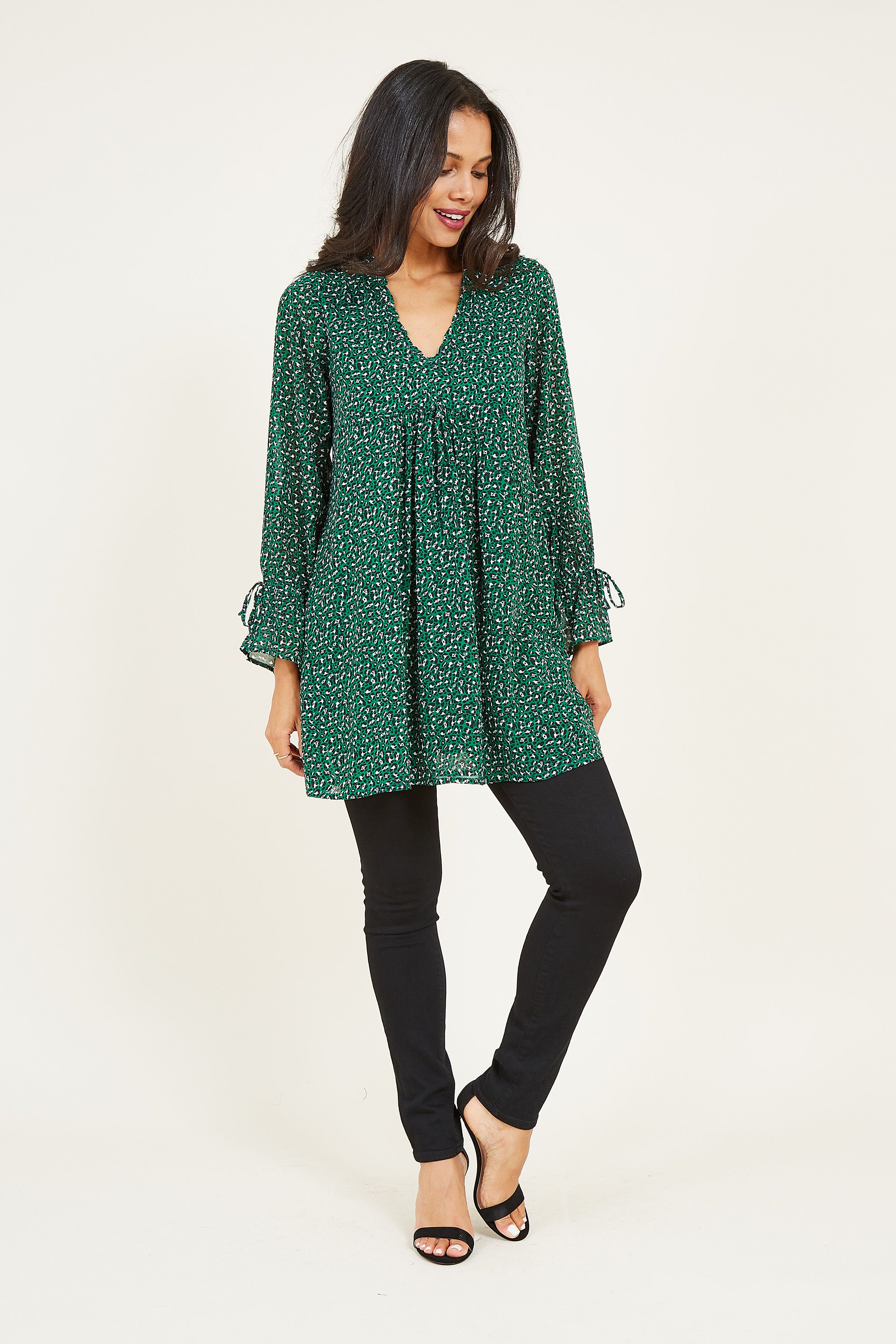 Strike a balance between comfort and style with our Leopard Tunic Dress. Detailed with an animal print with a wild edge, this casual dress is cut in a relaxed, knee-length shape. Three-quarter-length sleeves offer a versatile feel, with a swing movement enhanced by the layered front. Give your look a modern finish with a pair of chunky boots.