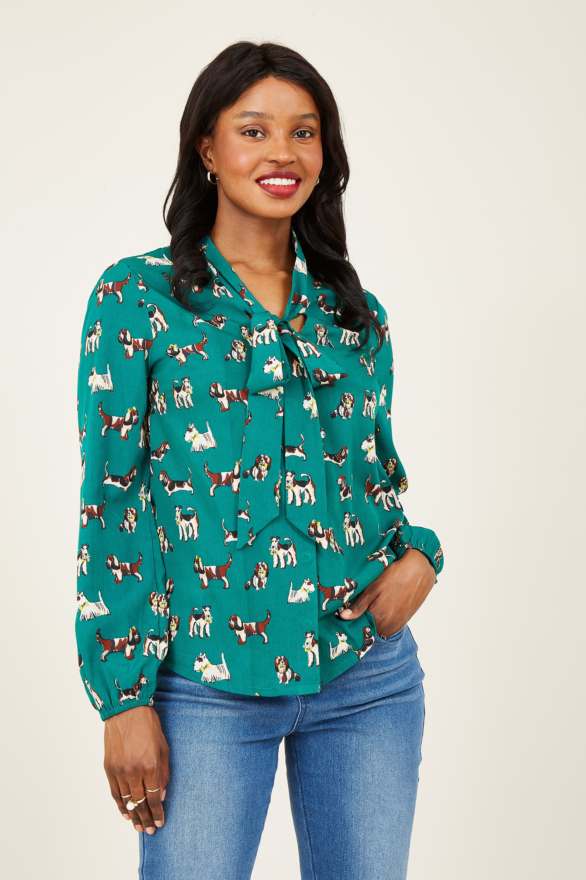 Inject some fun into your staples with our Dog Pussy Bow Blouse. Expertly crafted from light fabric, it's designed with a stylish dog print. The classic long sleeves and relaxed shape encourage a casual feel, paired with a pussy bow neckline to tie your look together. It's weekend and weekday appropriate.