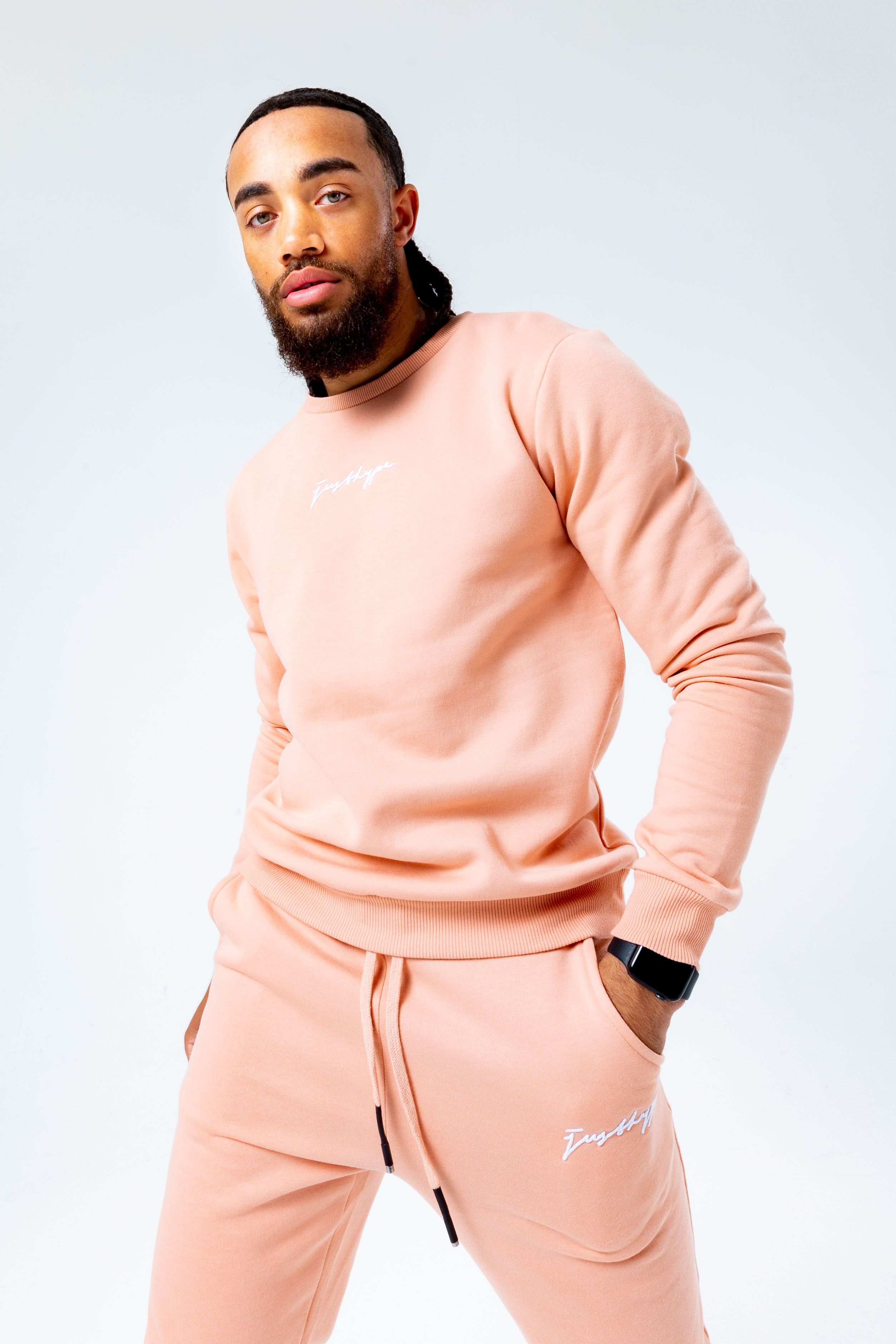 Introducing the HYPE. Pink Signature Men's Crewneck Jumper. Designed in a pink colour palette in a 80% cotton and 20% polyester fabric base for supreme comfort and breathable space. With a crew neckline, long sleeves and fitted hem and cuffs in our standard men's jumper shape. Finished with the new! justhype signature logo embroidered across the front in a contrasting white. Wear with the matching joggers to complete the look. Machine washable.